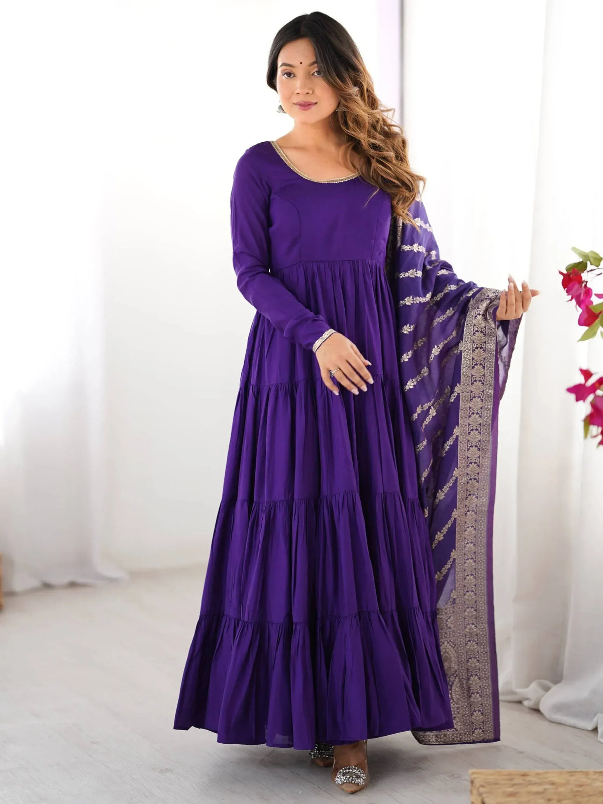 Purple tiered ethnic gown with gold embroidery and matching dupatta for women
