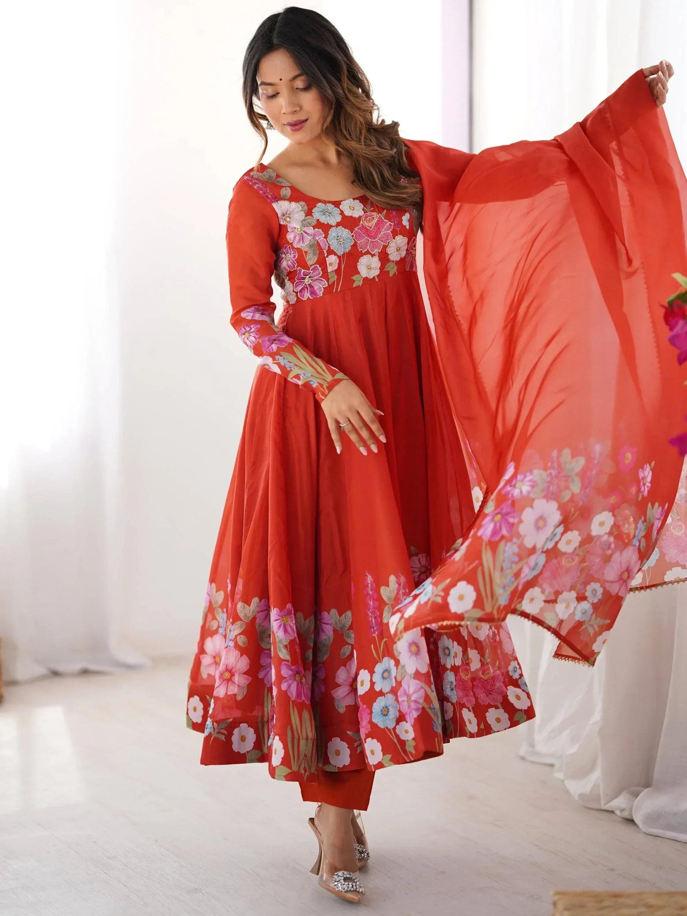 Red floral printed ethnic gown with matching dupatta, perfect for Indian occasions and festive wear.