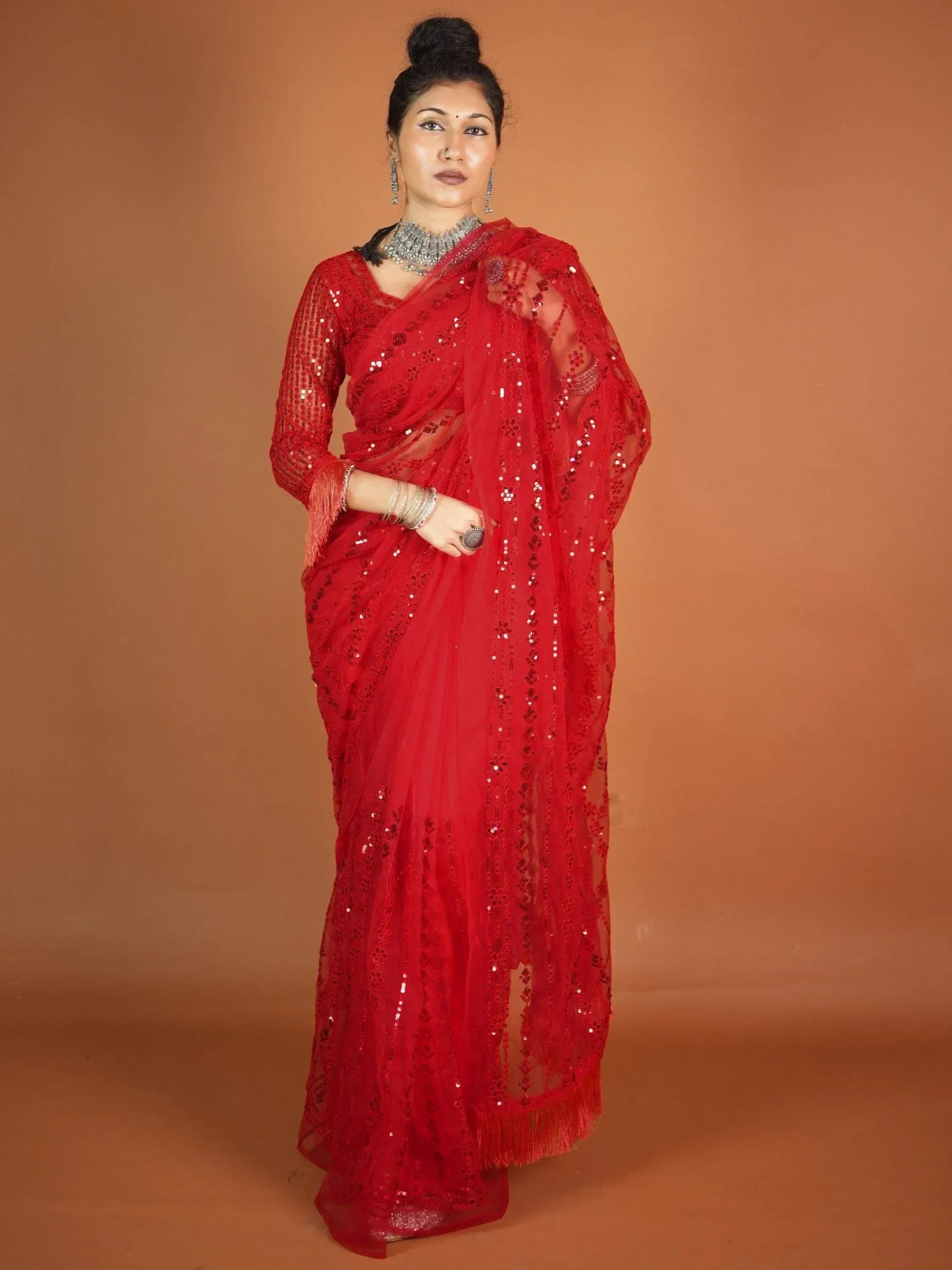 Red sequin saree with sheer blouse, perfect for Indian ethnic wear and festive occasions