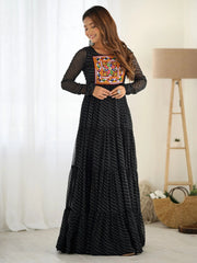 Woman in black ethnic gown with colorful embroidered yoke, standing indoors, Ethnic Plus fashion