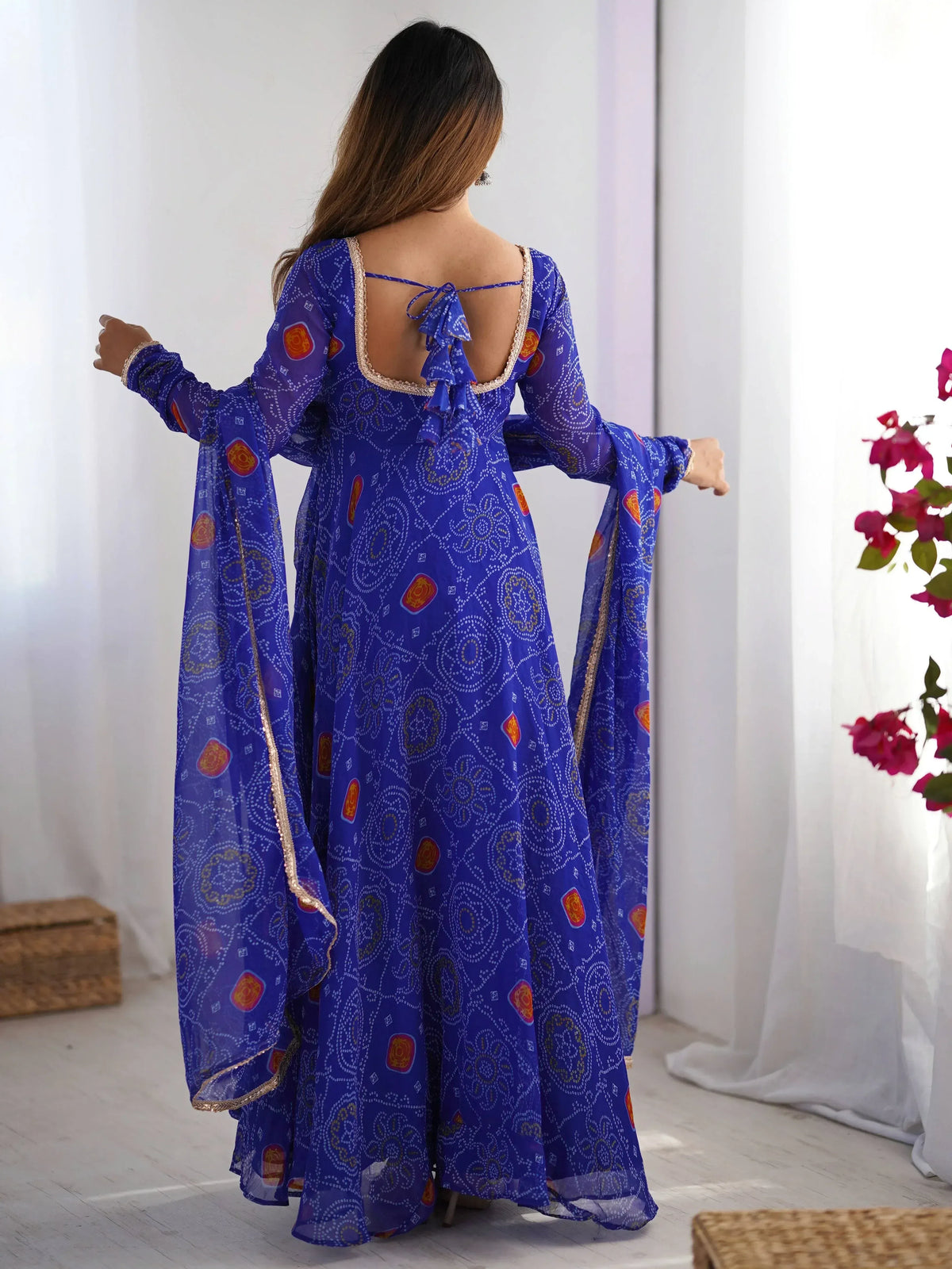 Blue printed ethnic gown with back tie detail and gold trim
