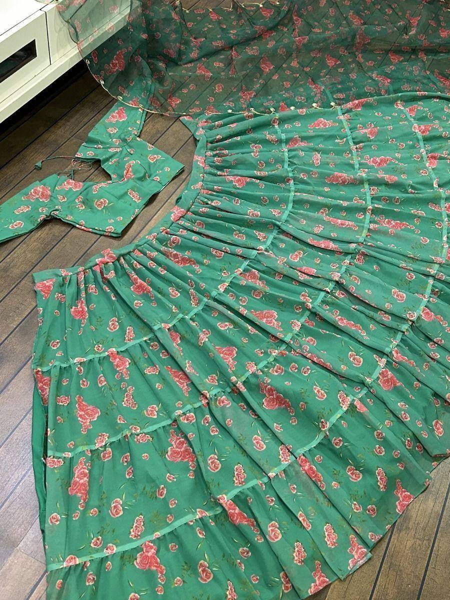 Green floral print ethnic gown with tiered ruffles, perfect for Indian occasions and festive wear.