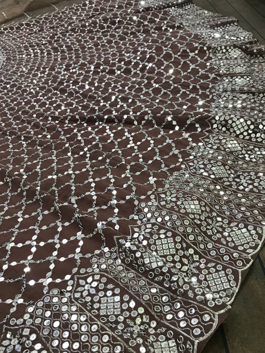 Brown ethnic lehenga with silver mirror work and sequin embroidery, traditional Indian wedding wear