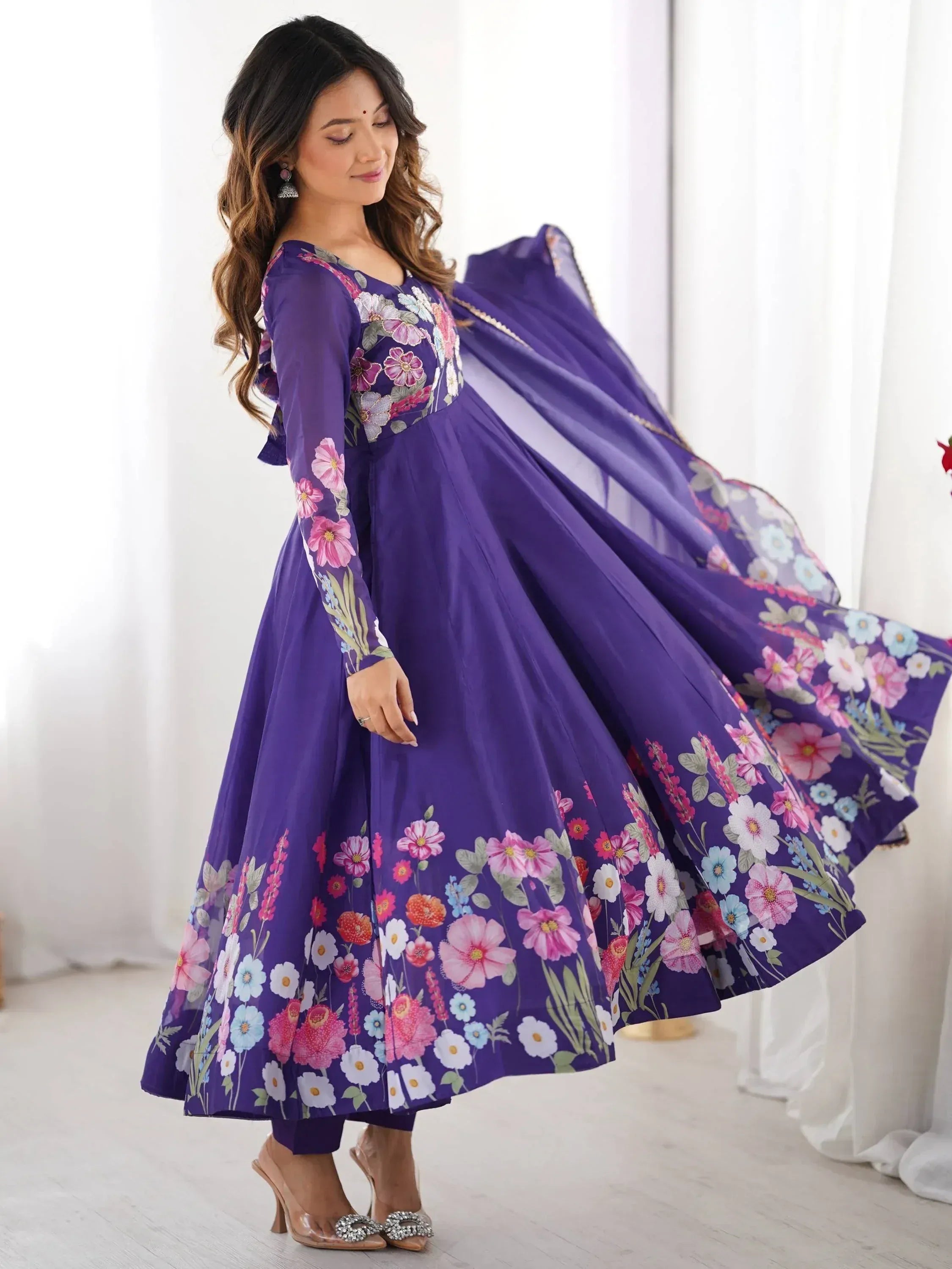 Purple floral print ethnic gown with long sleeves and flared skirt, perfect for Indian occasions