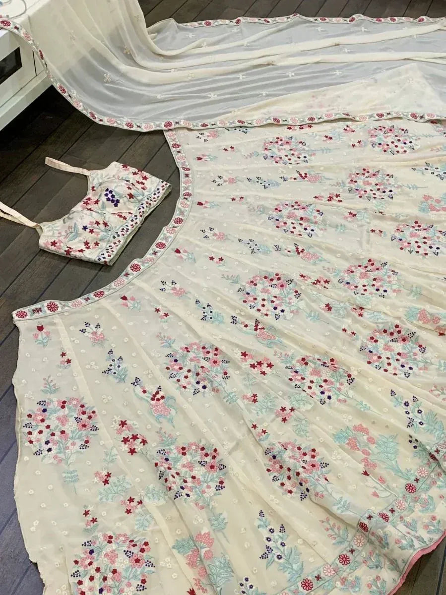 Floral embroidered off-white lehenga choli with matching dupatta, perfect for ethnic occasions