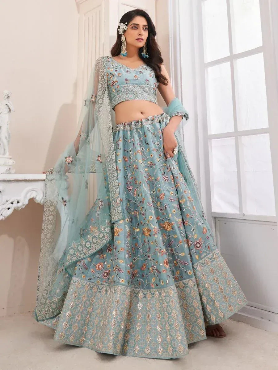 Light blue embroidered lehenga choli with floral motifs and sheer dupatta, perfect for Indian ethnic occasions