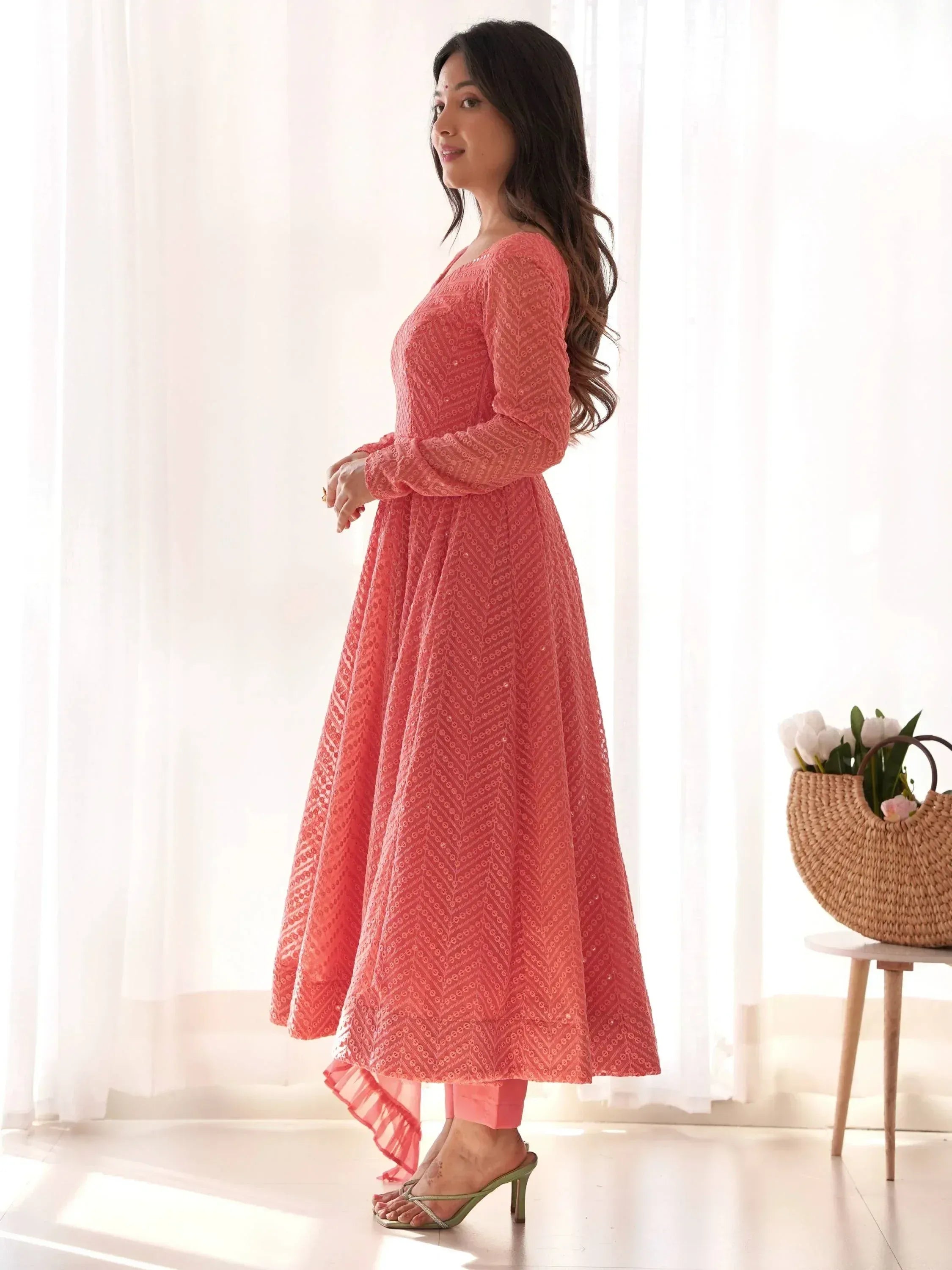 Coral ethnic gown with chevron embroidery, perfect for Indian occasions and festive wear.