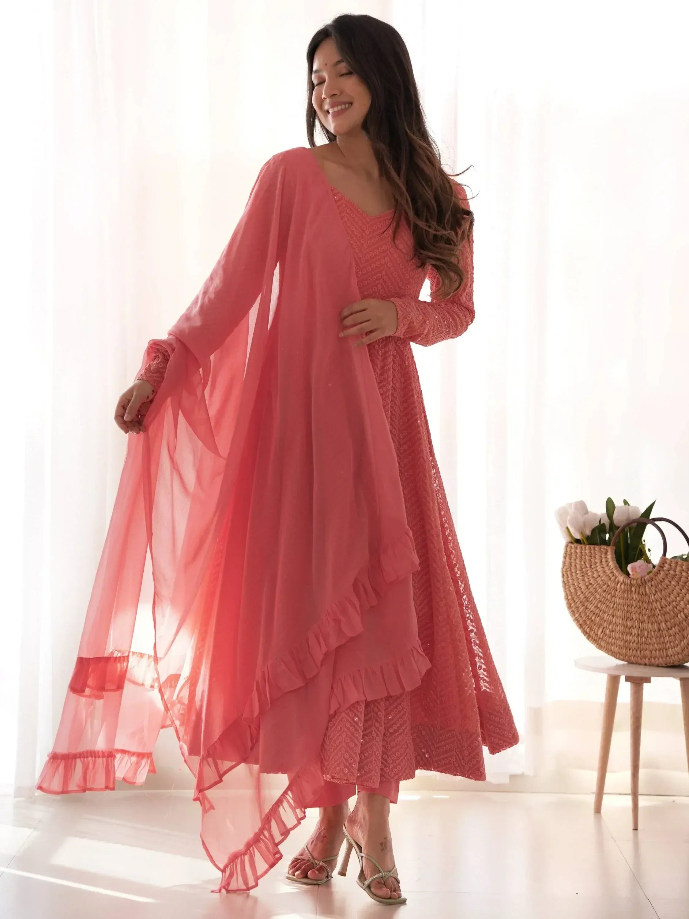 Pink embroidered ethnic gown with ruffled overlay and matching palazzo, perfect for Indian occasions