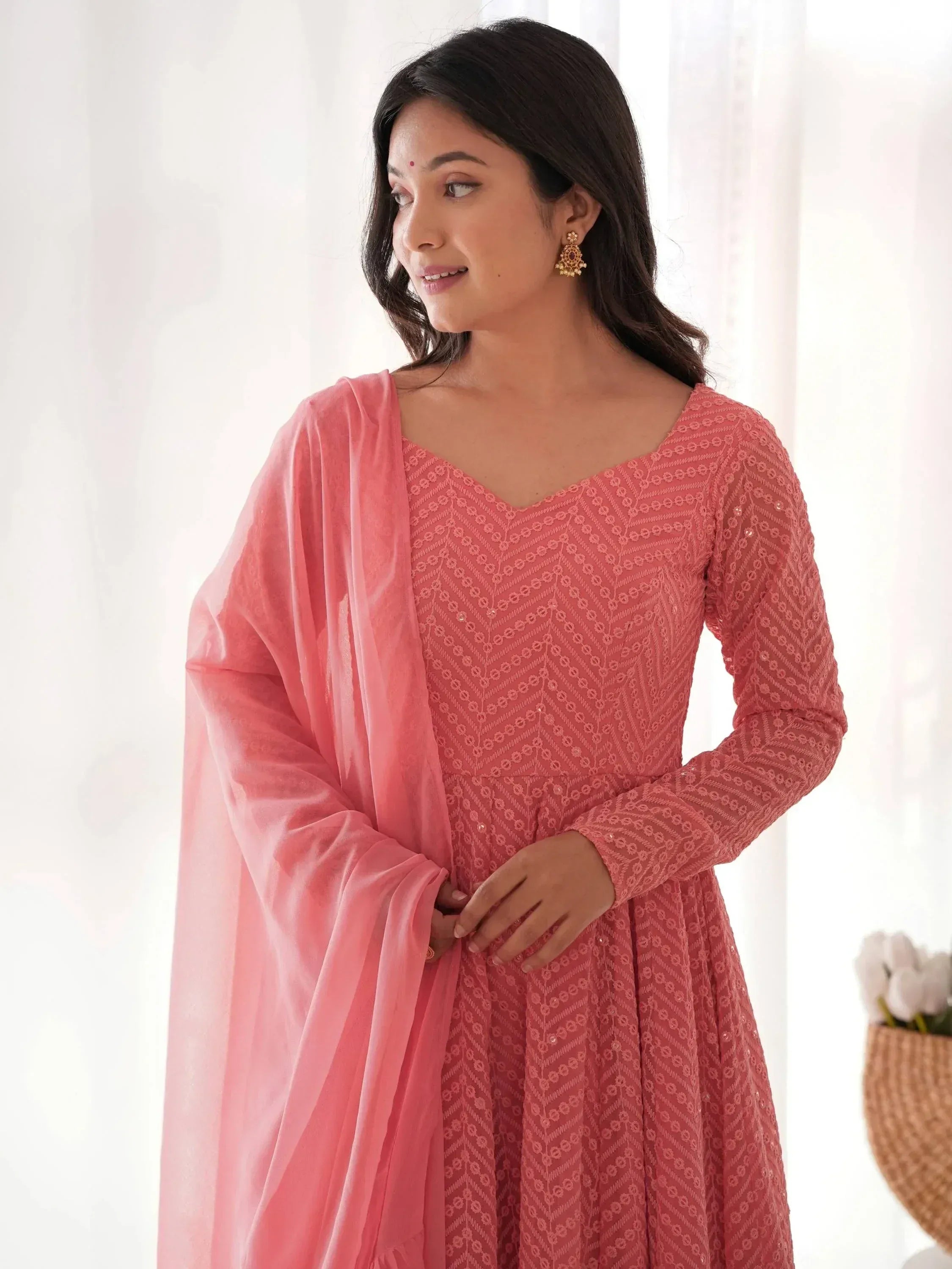 Pink embroidered ethnic gown with matching dupatta, perfect for Indian occasions and festive wear.