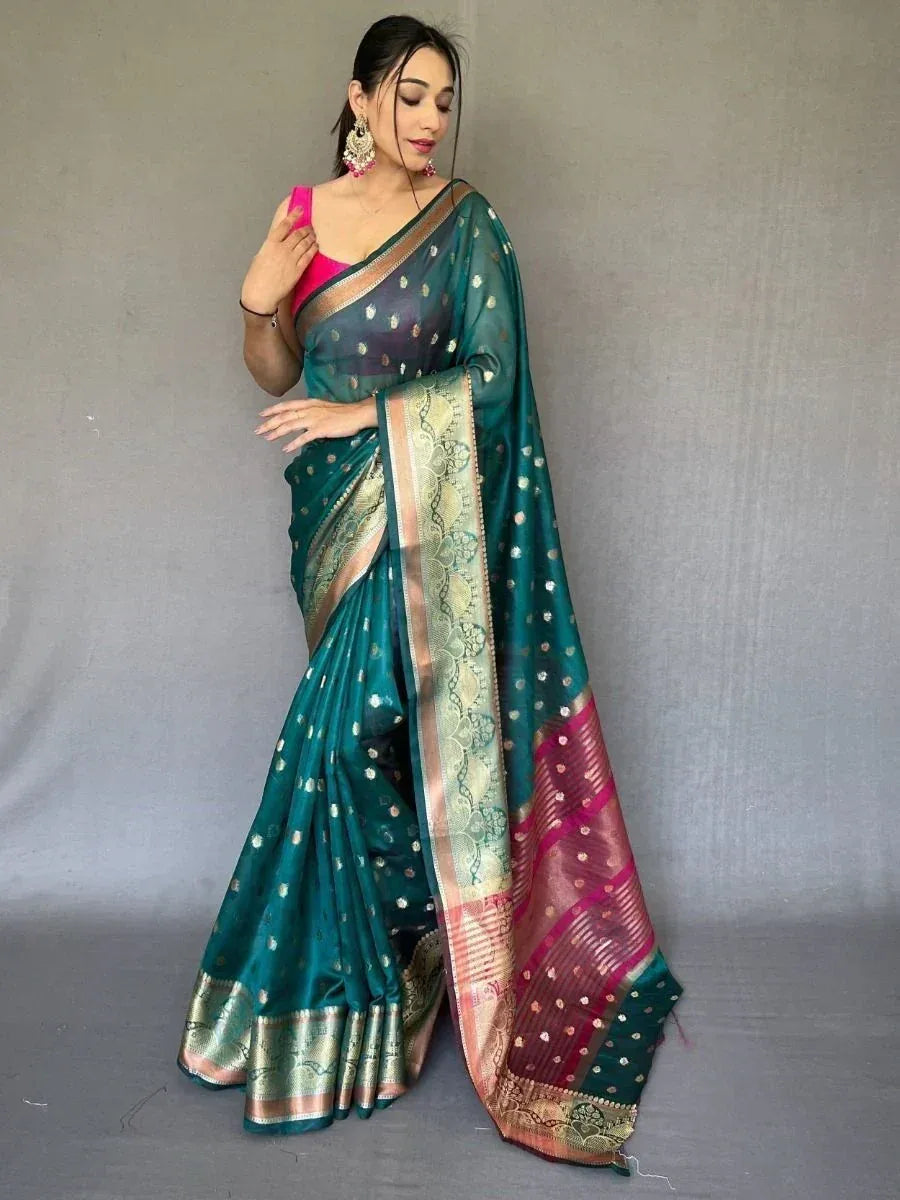 Teal silk saree with gold motifs and pink border, paired with pink blouse, ethnic Indian wear