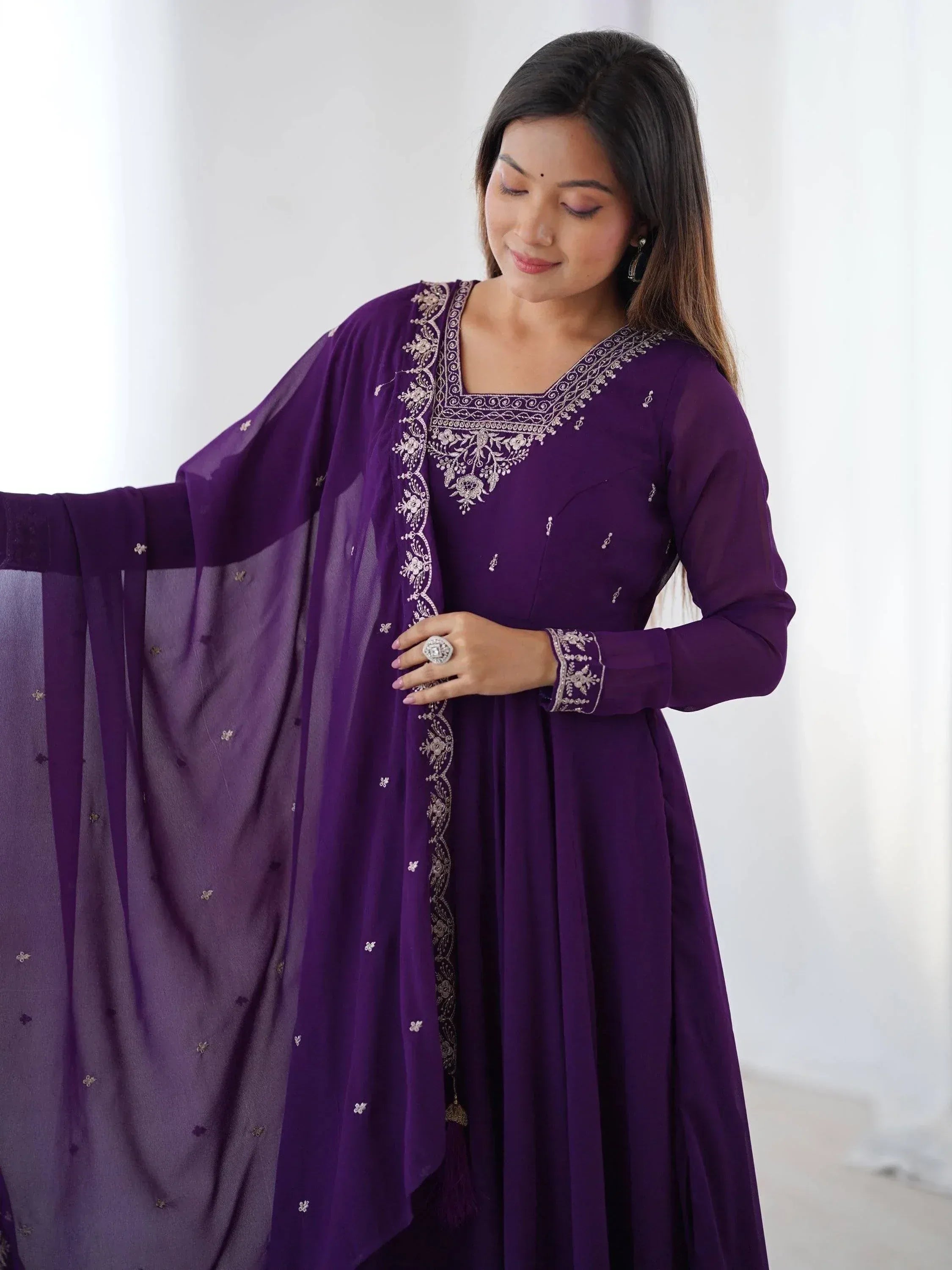 Purple embroidered ethnic gown with matching dupatta, perfect for Indian festive occasions