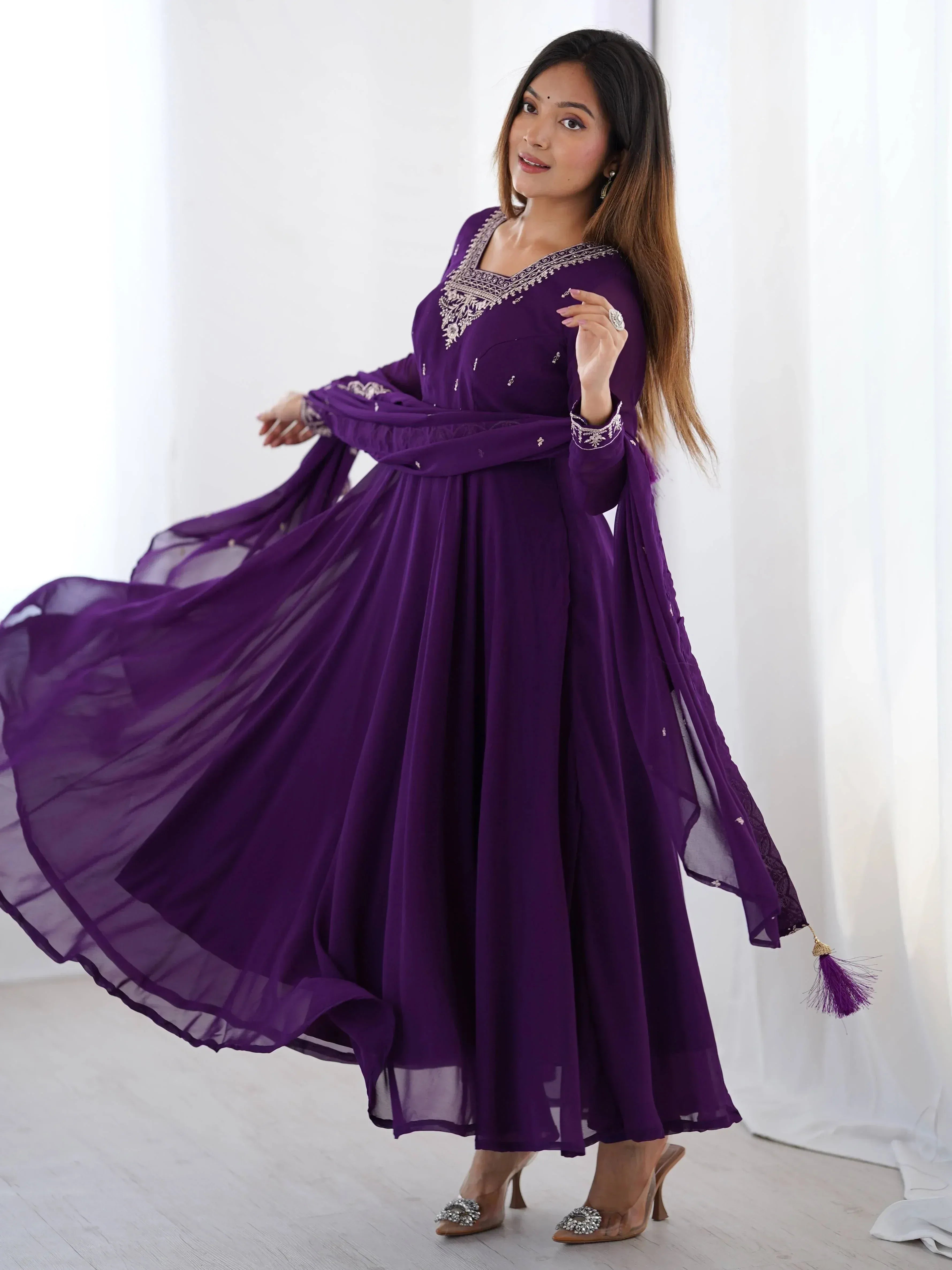 Purple ethnic gown with embroidery, perfect for Indian occasions and festive wear.