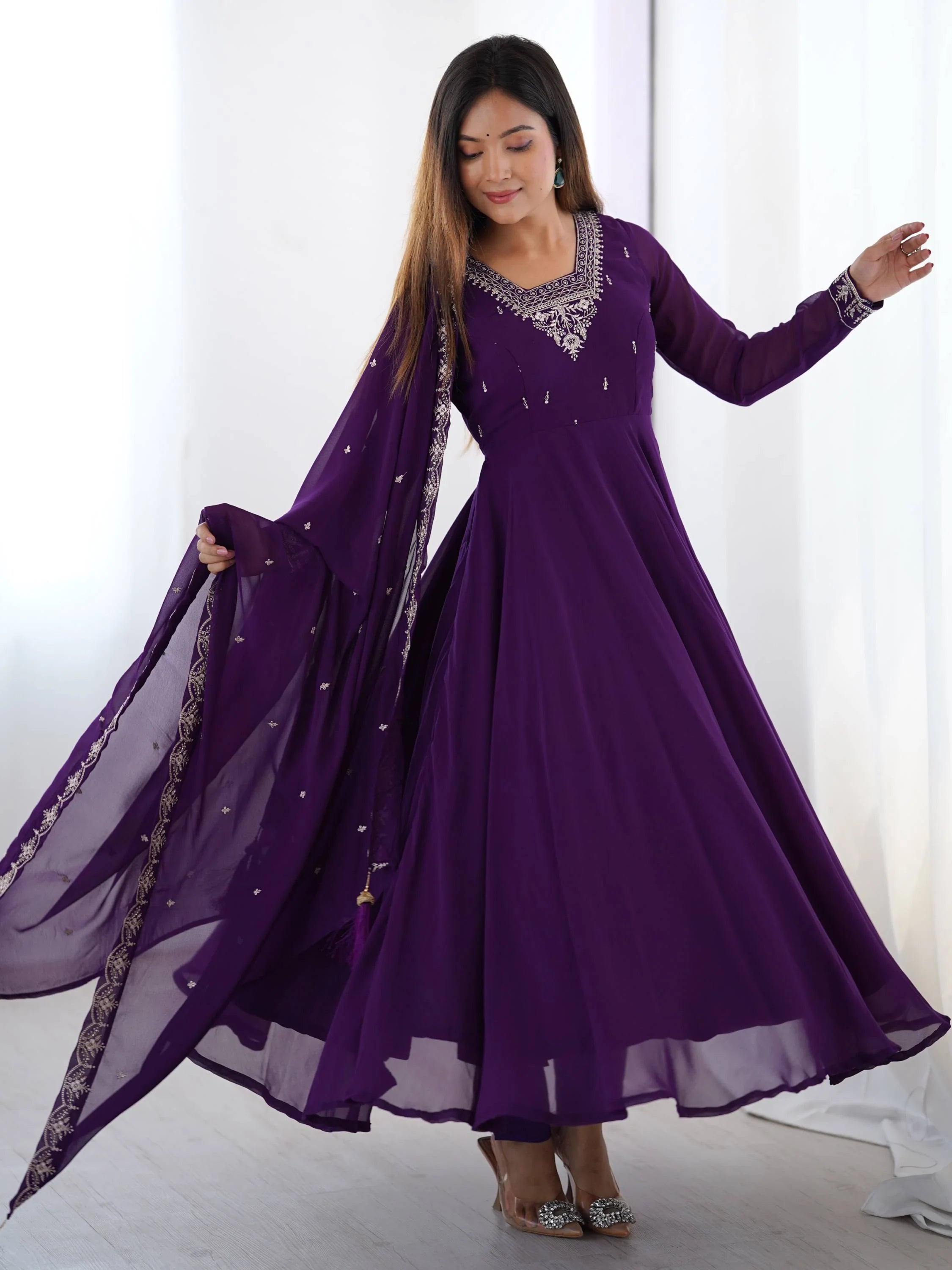 Purple ethnic gown with embroidery and matching dupatta, perfect for Indian occasions
