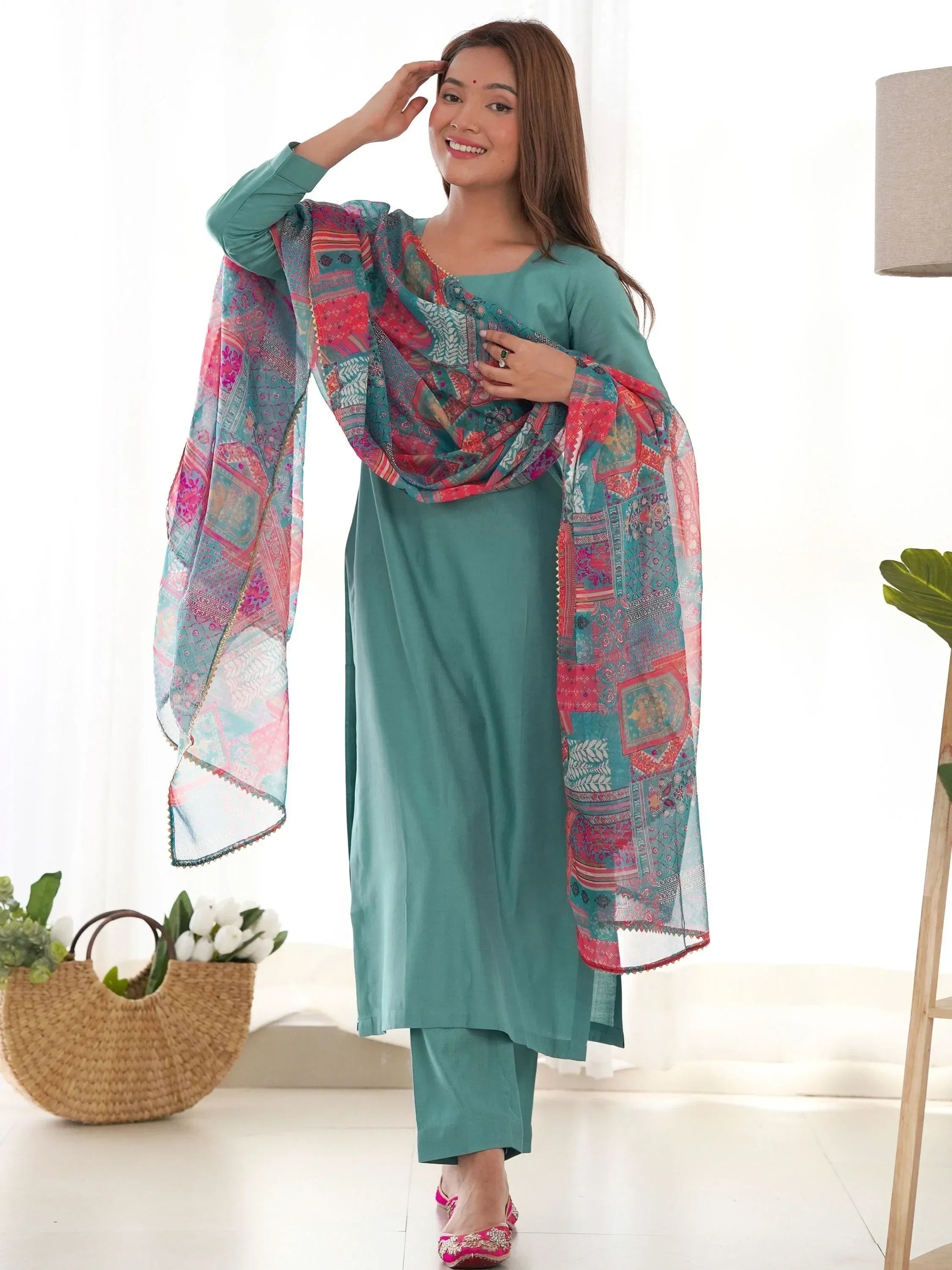 Woman wearing teal salwar kameez with colorful printed dupatta, Indian ethnic wear