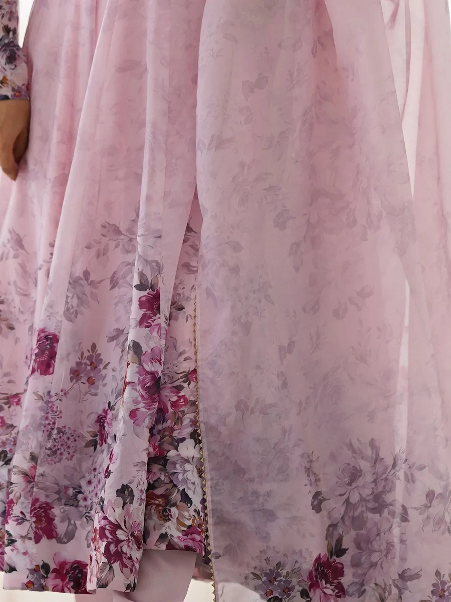 Pink floral ethnic gown with sheer fabric and intricate flower patterns