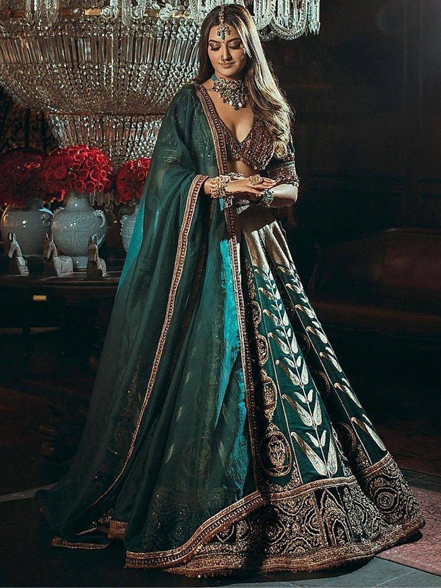 Emerald green designer lehenga choli with gold embroidery, perfect for Indian weddings and festive occasions.