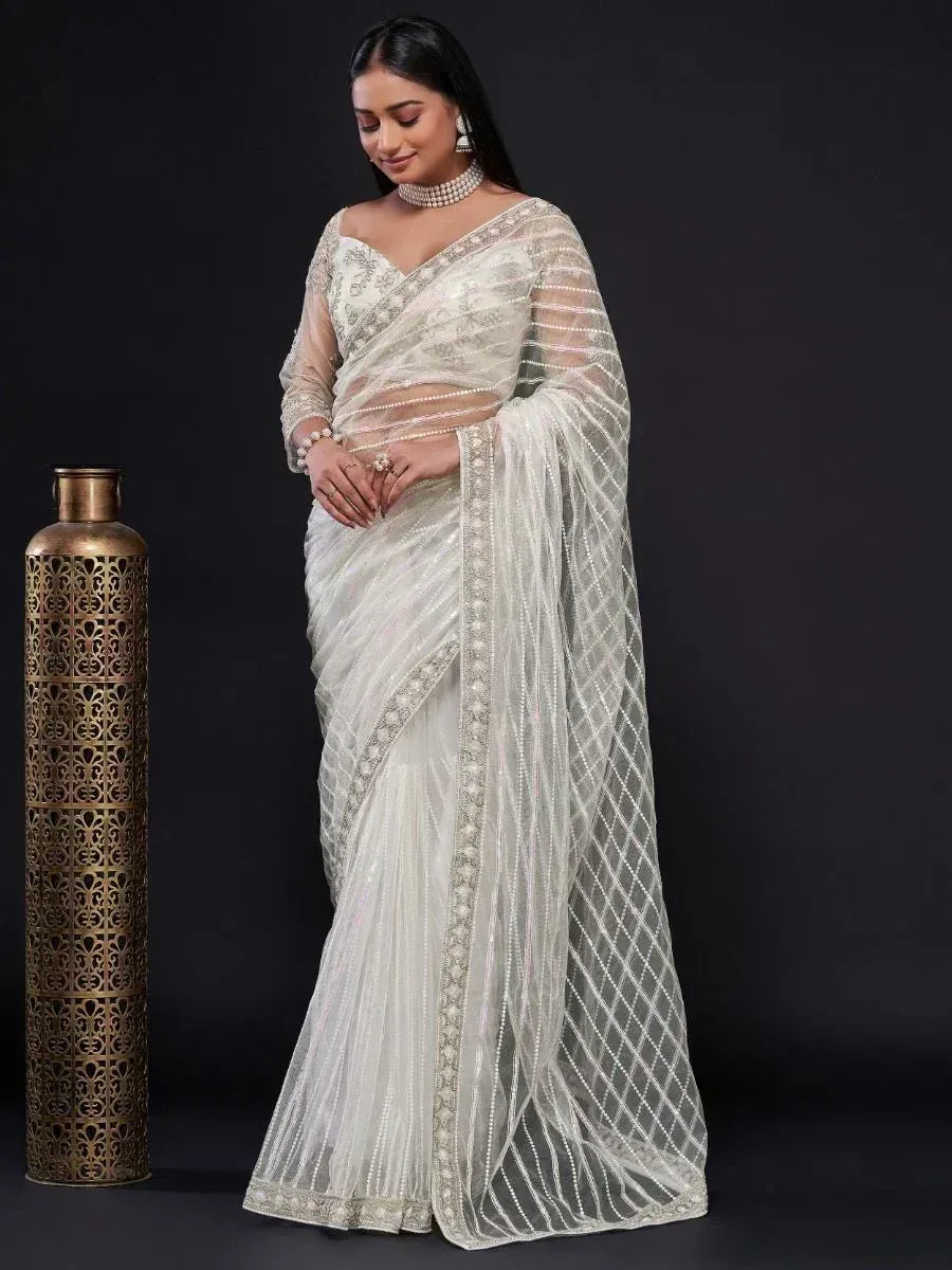 Elegant white embroidered saree with sheer blouse, perfect for Indian ethnic occasions and weddings