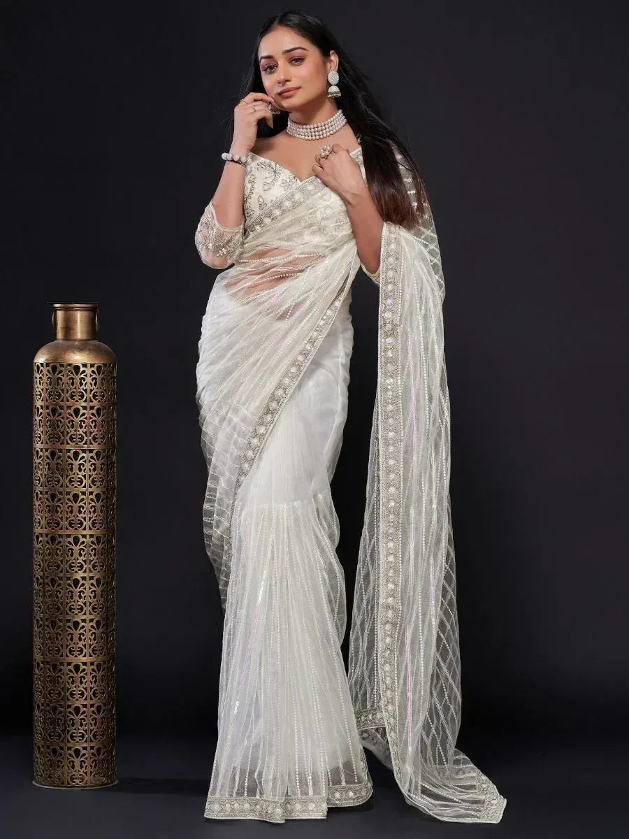 Elegant white embroidered saree with sequin detailing, perfect for Indian ethnic wear occasions