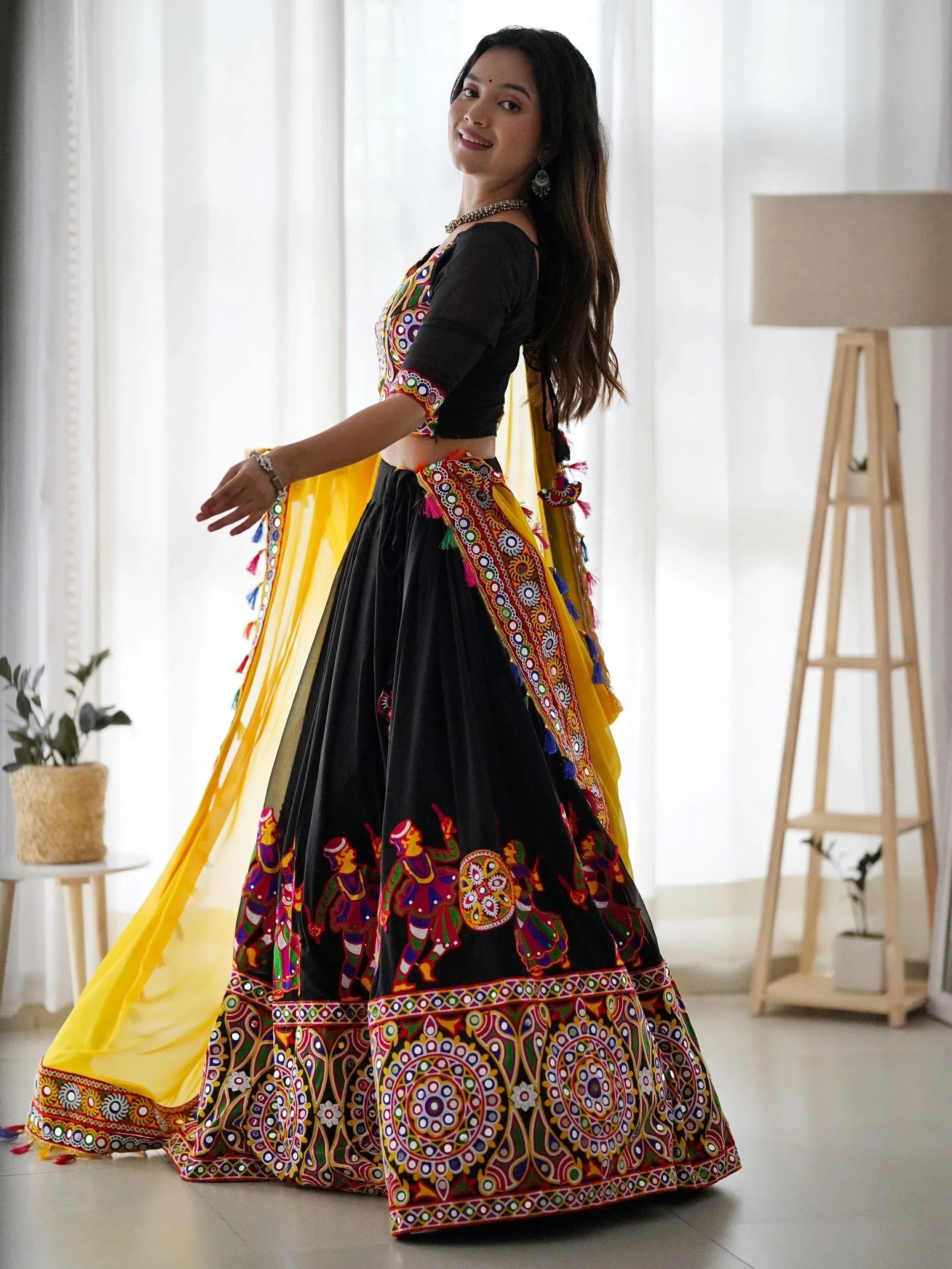 Black and yellow embroidered lehenga choli with mirror work and dupatta, Indian ethnic wear