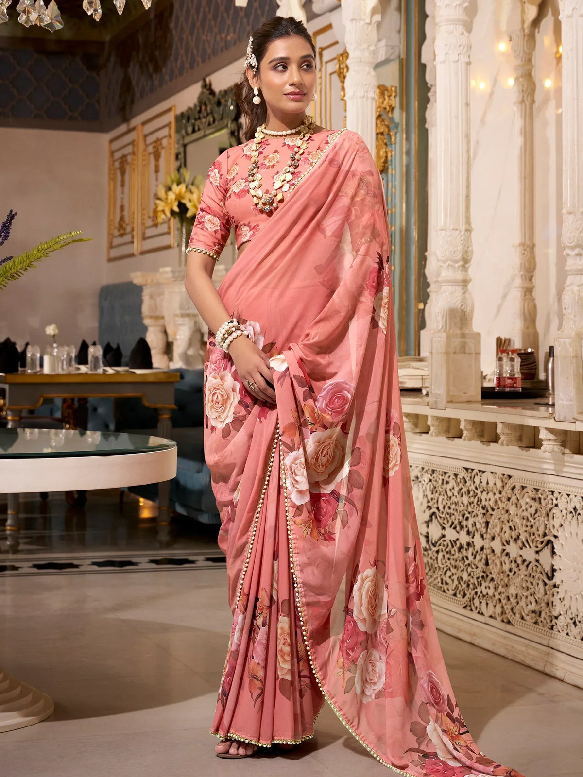 Pink floral saree with gold trim, styled for Indian ethnic wear occasions
