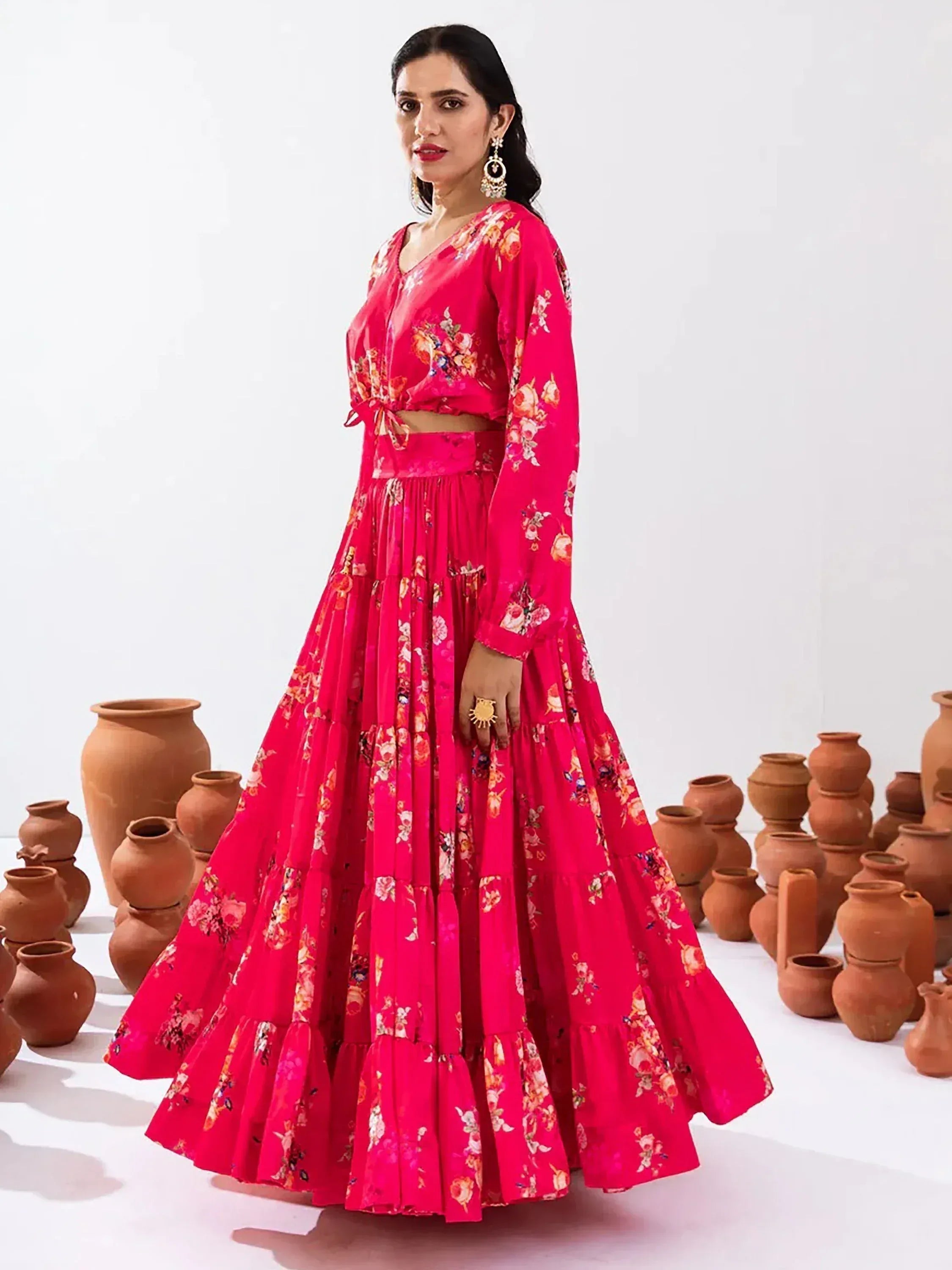 Vibrant pink floral lehenga choli with tiered skirt, perfect for Indian ethnic wear occasions