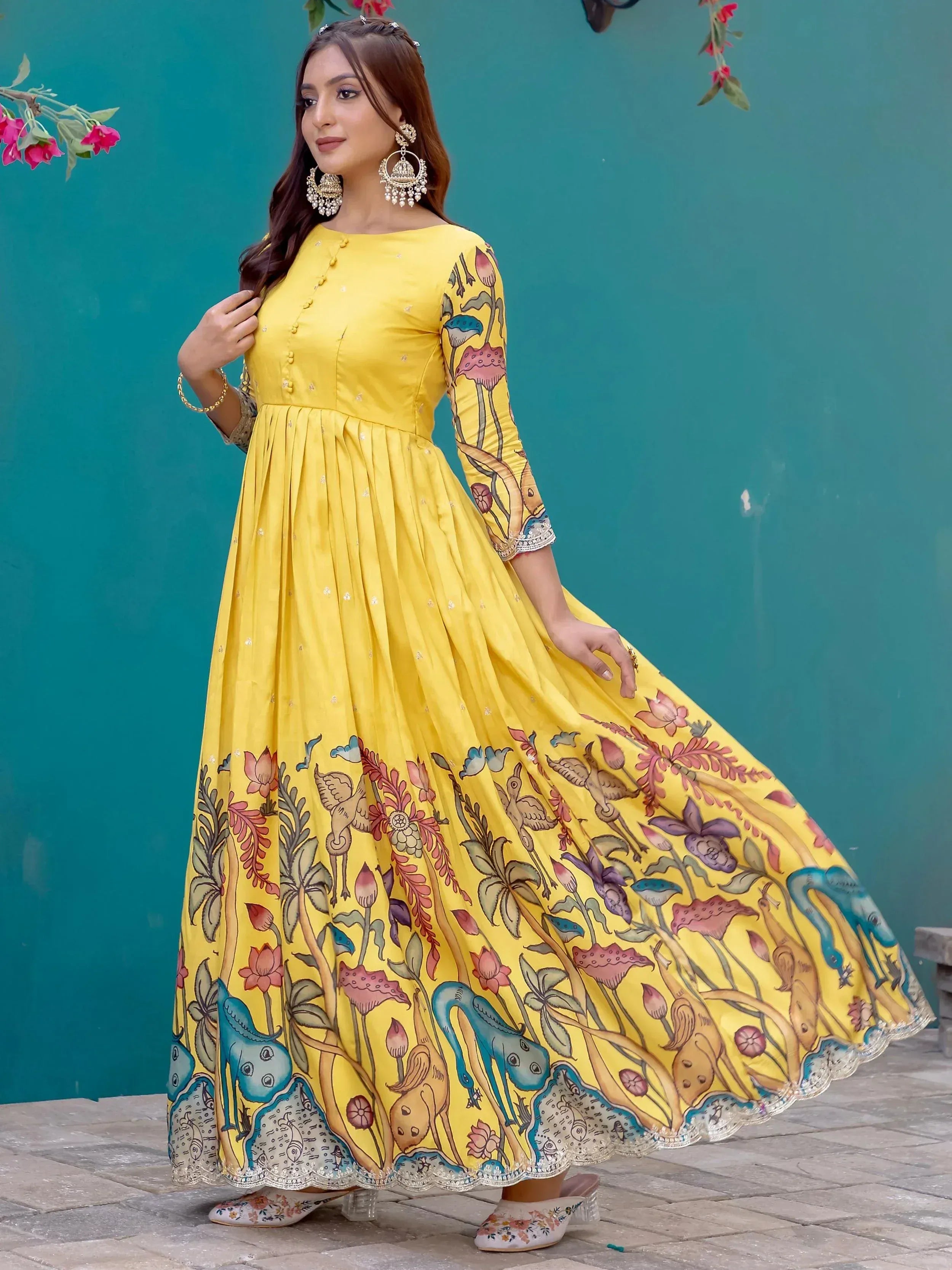 Yellow ethnic gown with floral and bird print, perfect for Indian occasions and festive wear.