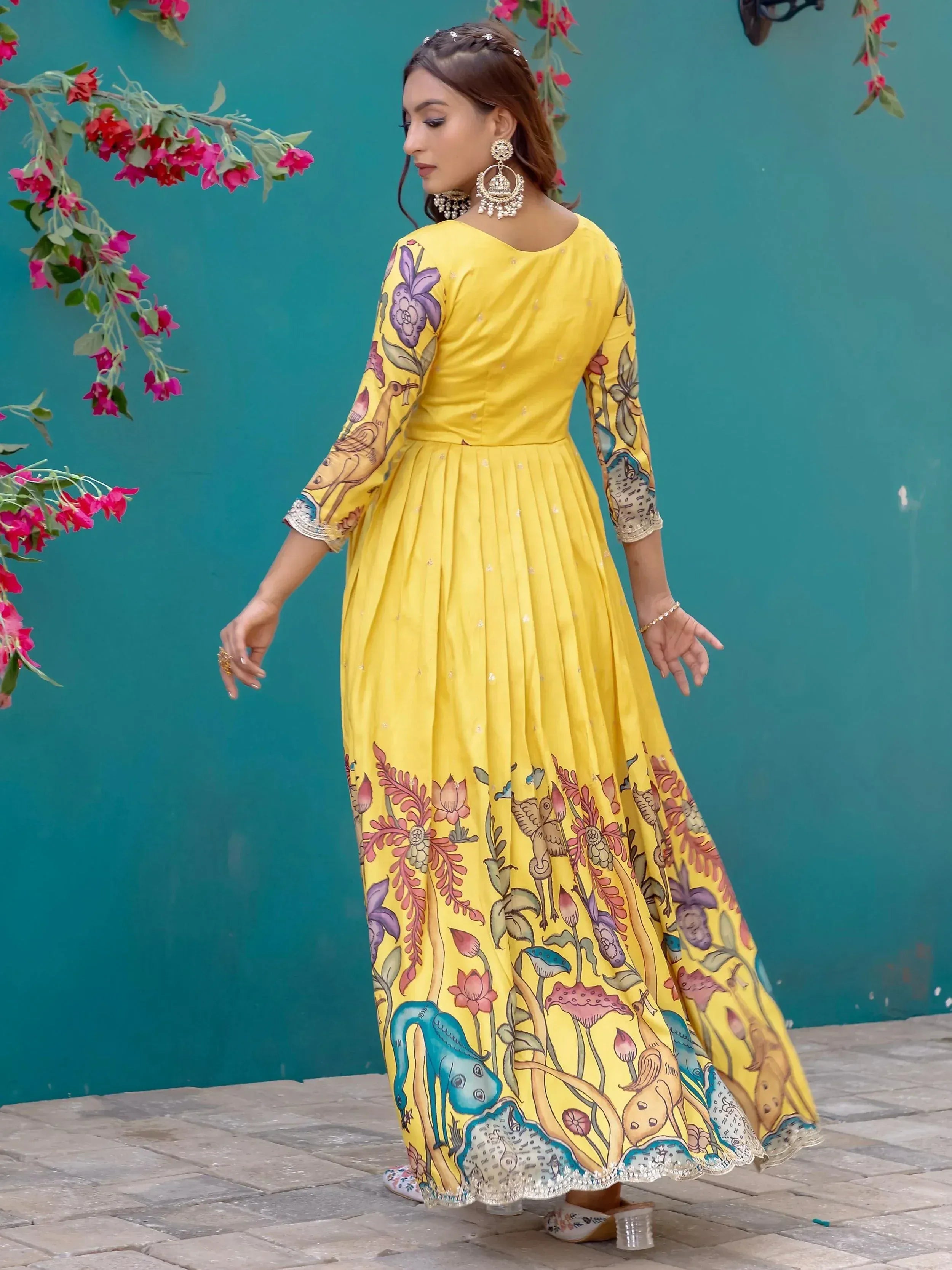 Yellow floral print ethnic gown with bird motifs, perfect for Indian festive occasions
