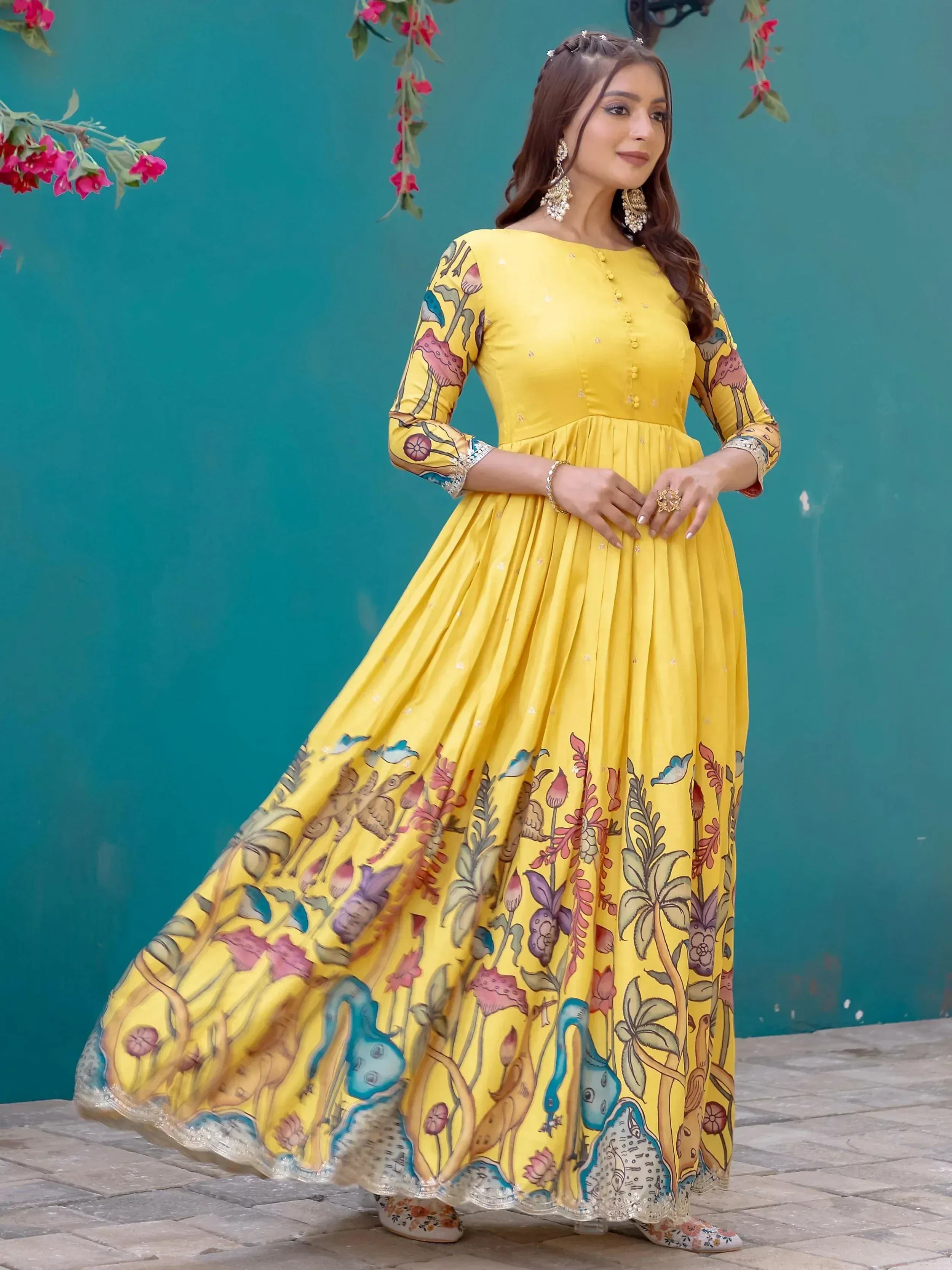 Yellow floral print ethnic gown with long sleeves and pleated skirt, perfect for Indian occasions