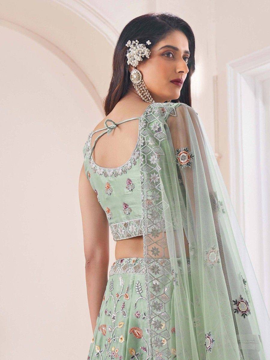 Mint green embroidered lehenga choli with sheer dupatta, floral motifs, and back tie detail for Indian ethnic wear