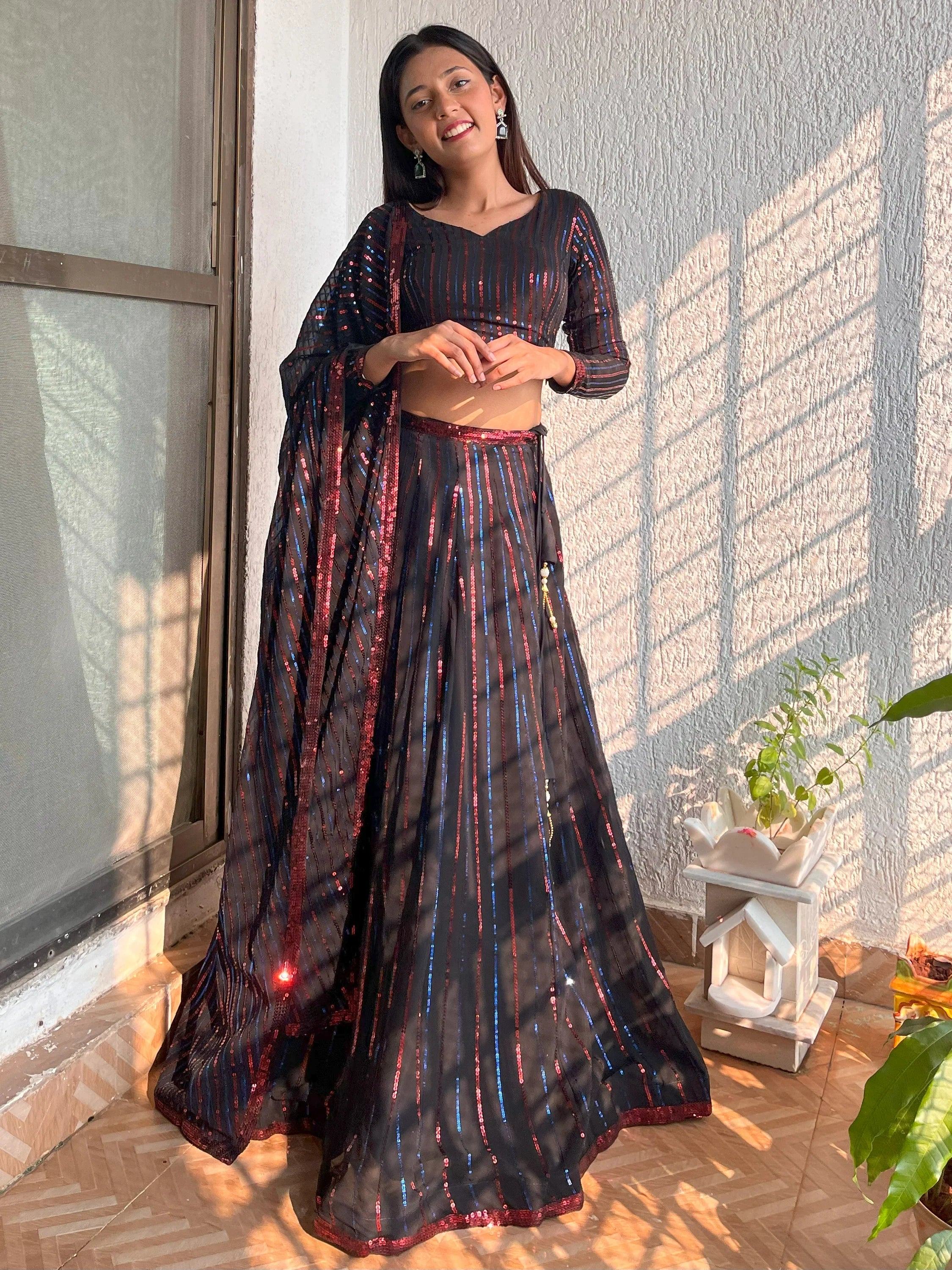 Black sequin lehenga choli with red and blue stripes, perfect for Indian ethnic wear events