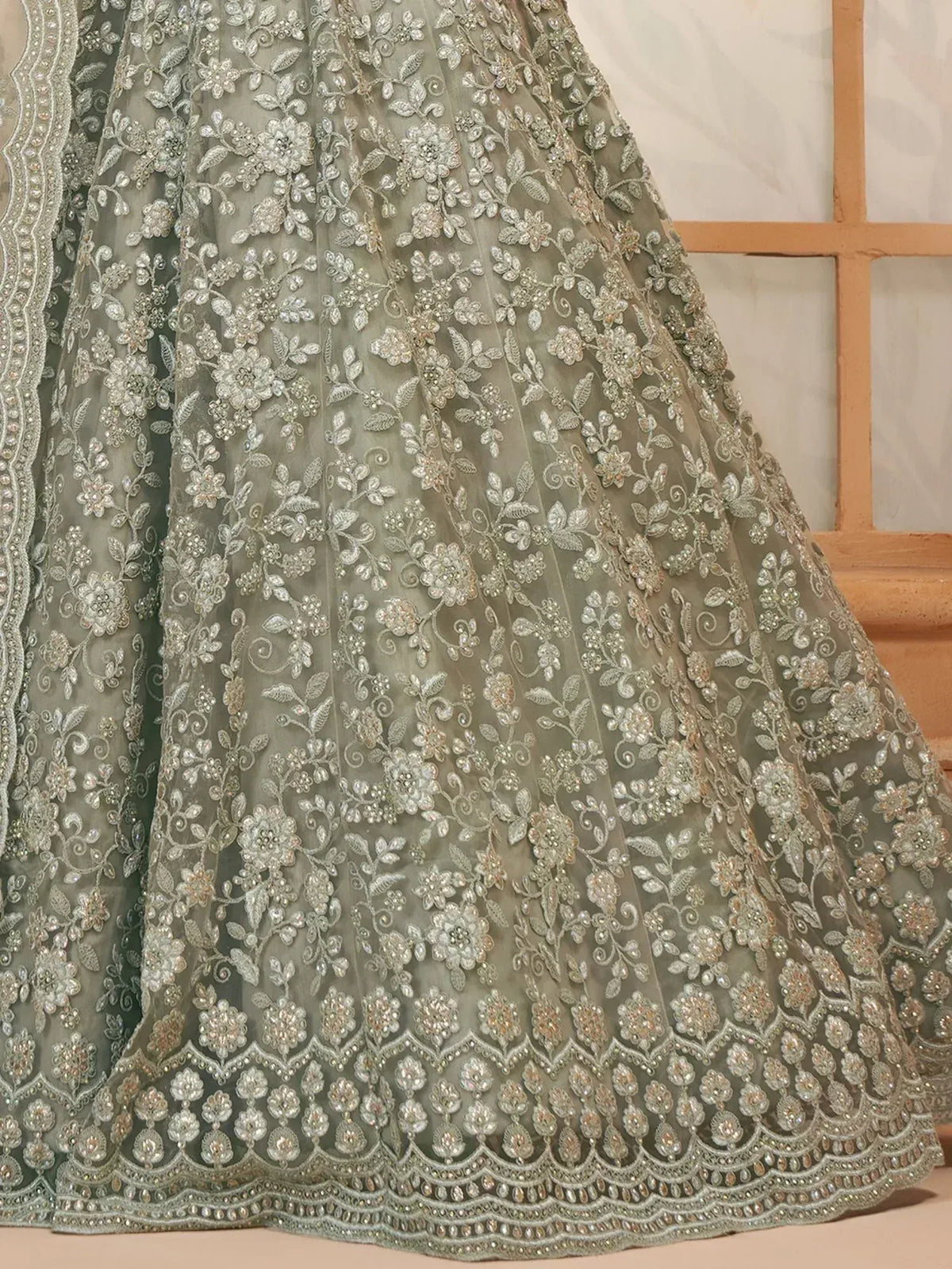 Grey floral embroidered lehenga with silver zari and beadwork, perfect for Indian weddings and festive occasions.