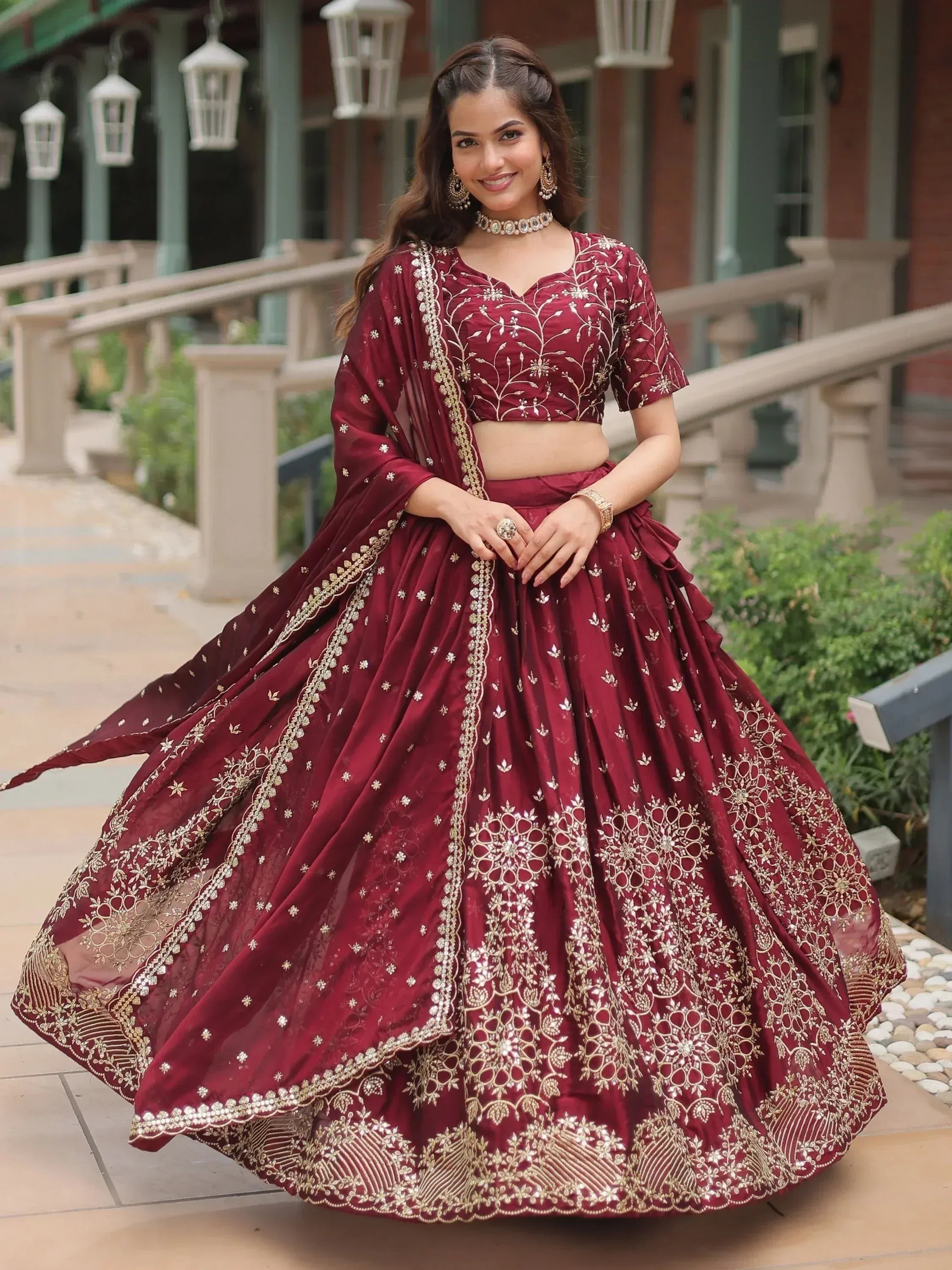 Maroon designer lehenga choli with gold embroidery, perfect for Indian weddings and festive occasions
