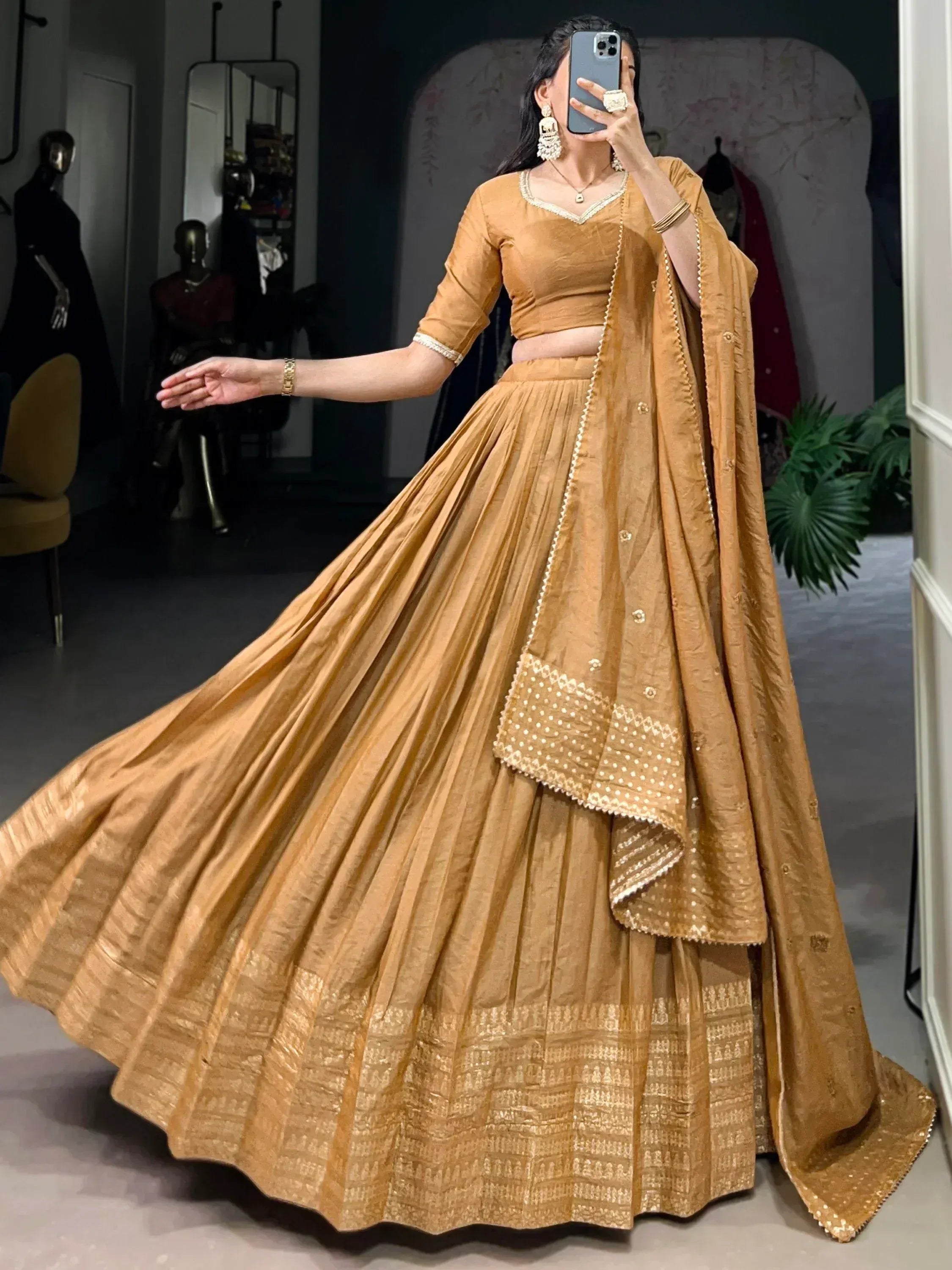 Golden lehenga choli with pleated skirt and embroidered dupatta, perfect for Indian ethnic occasions