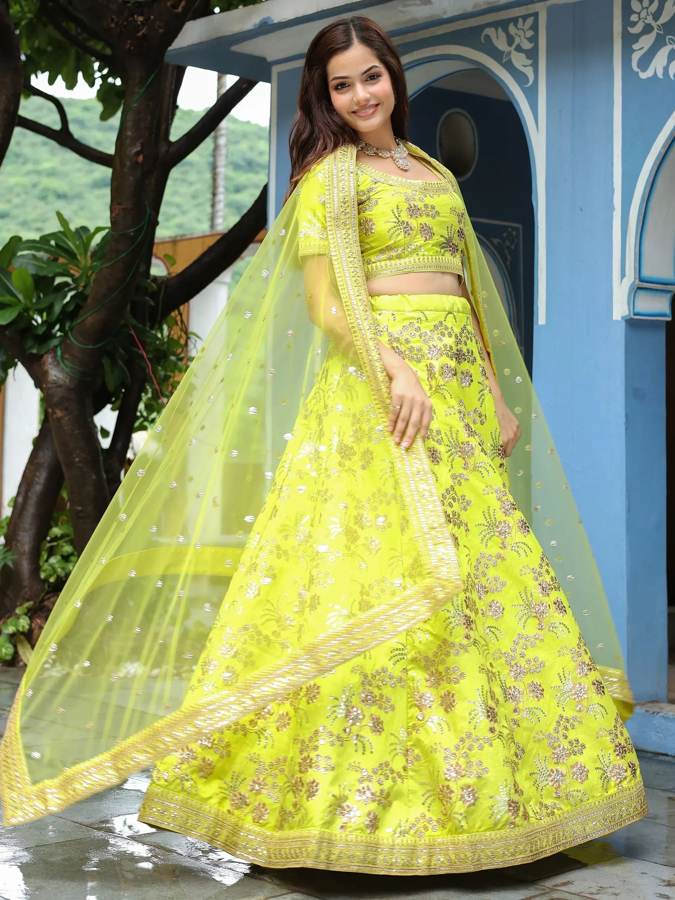 Bright yellow embroidered lehenga choli with sheer dupatta, perfect for Indian ethnic occasions