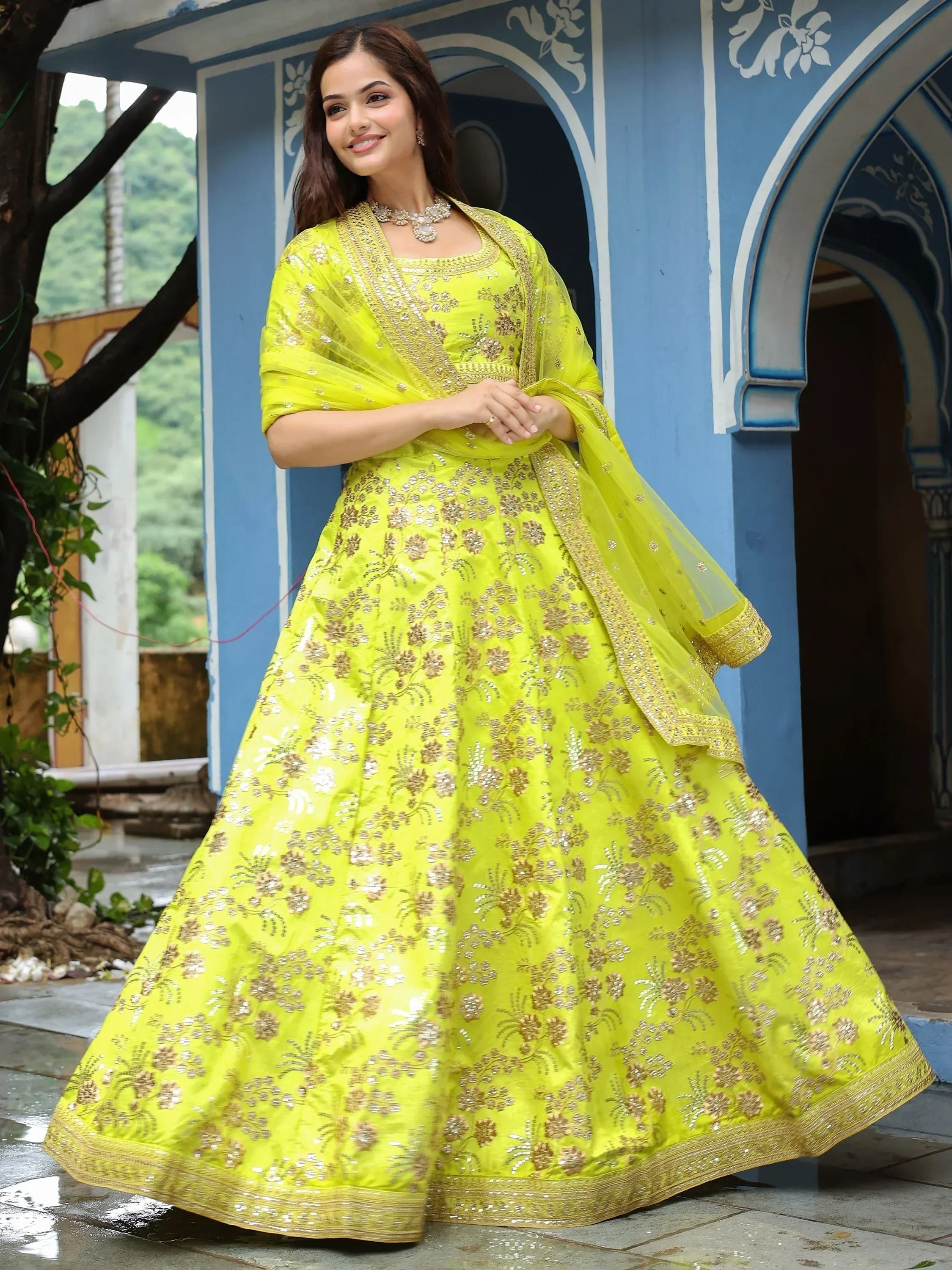 Bright yellow embroidered lehenga choli with gold floral work, perfect for Indian ethnic occasions