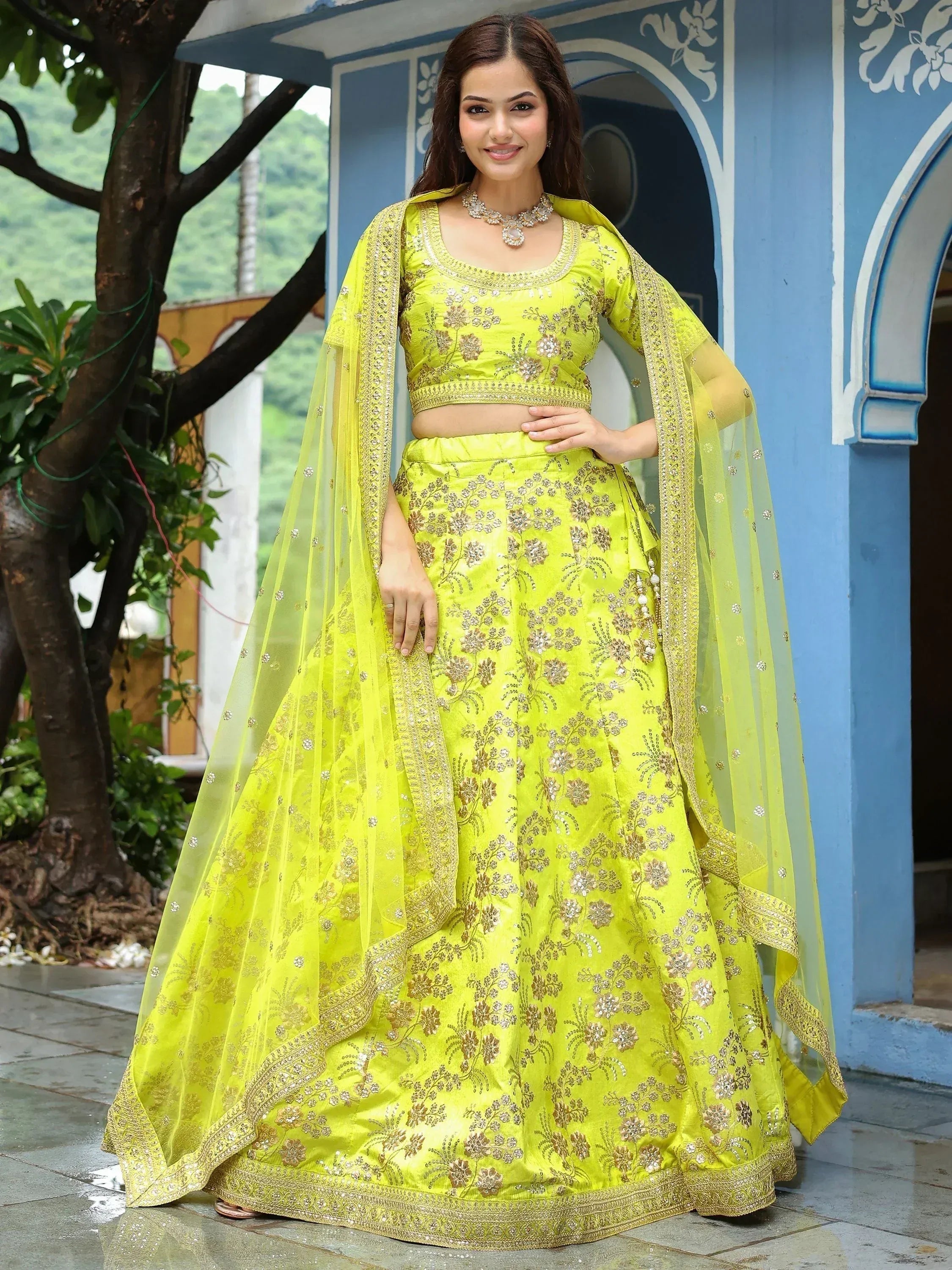 Lime green embroidered lehenga choli with gold floral work and matching dupatta, perfect for Indian ethnic occasions.