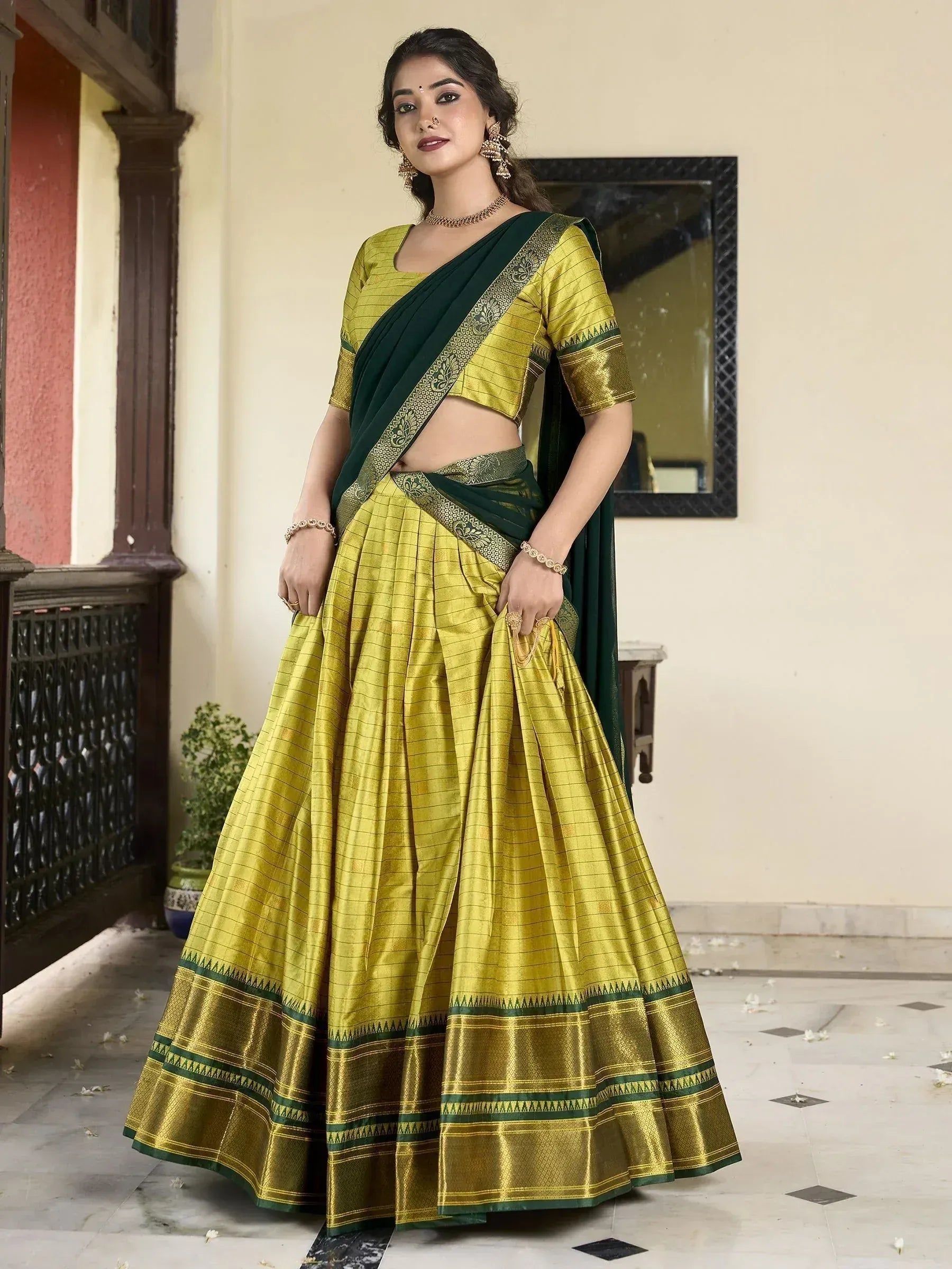 Yellow and green designer lehenga choli with embroidered border, perfect for Indian ethnic wear occasions