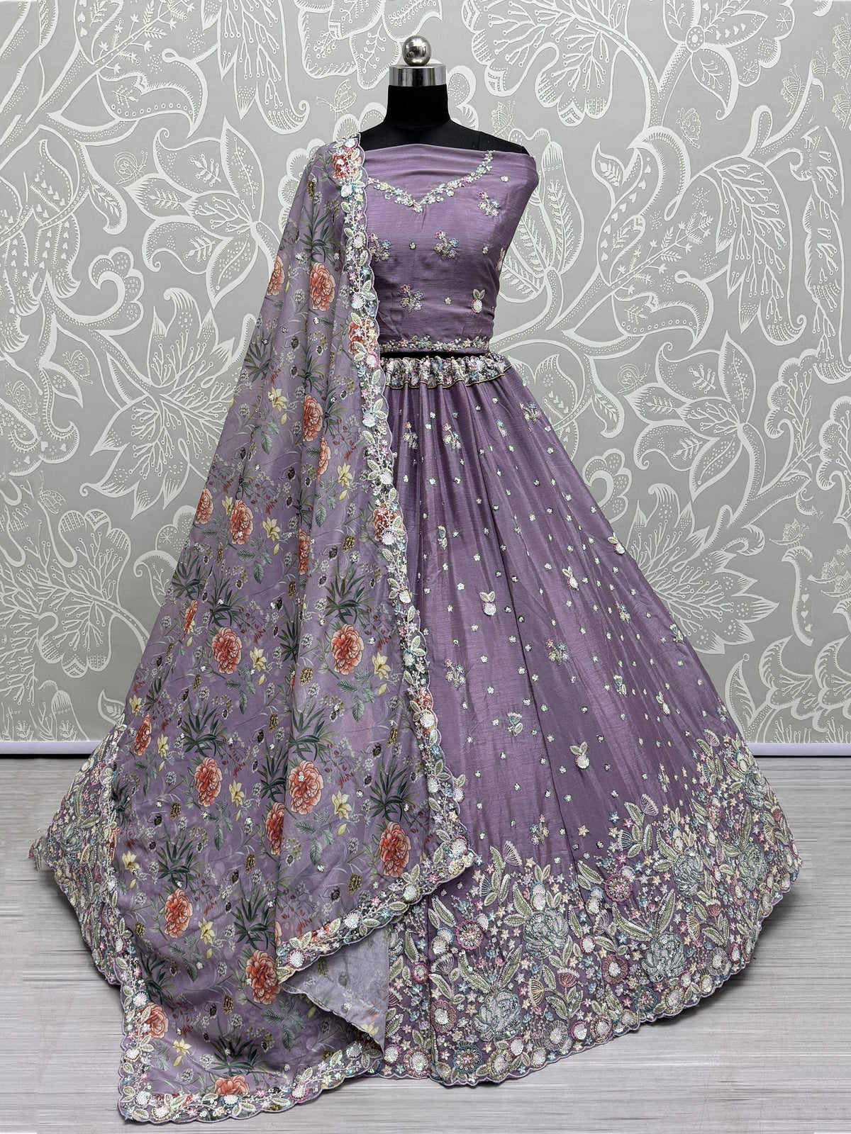 Lavender designer lehenga choli with floral embroidery and matching dupatta, perfect for Indian ethnic occasions.