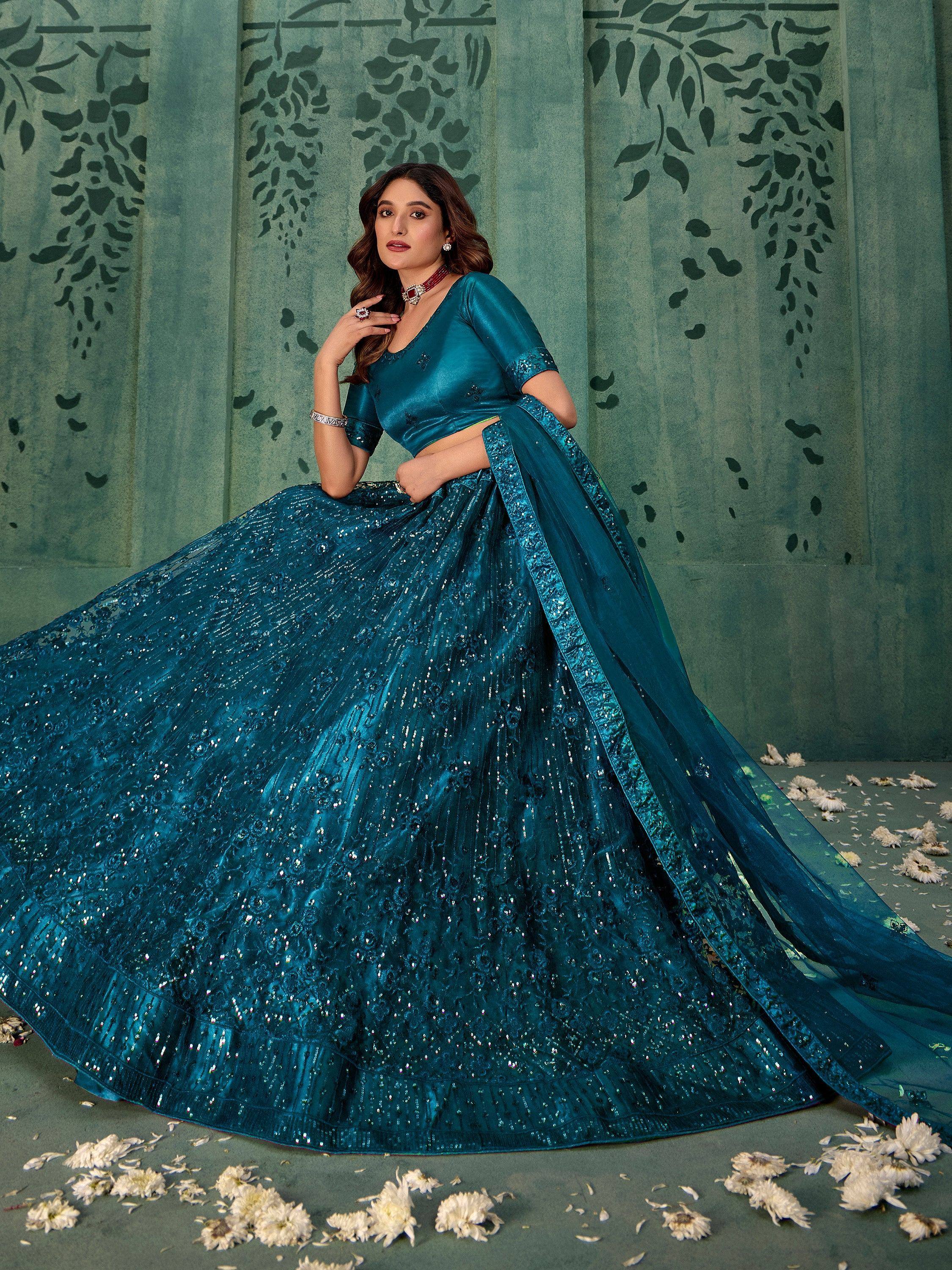 Teal designer lehenga choli with sequin embroidery, perfect for Indian weddings and festive occasions.