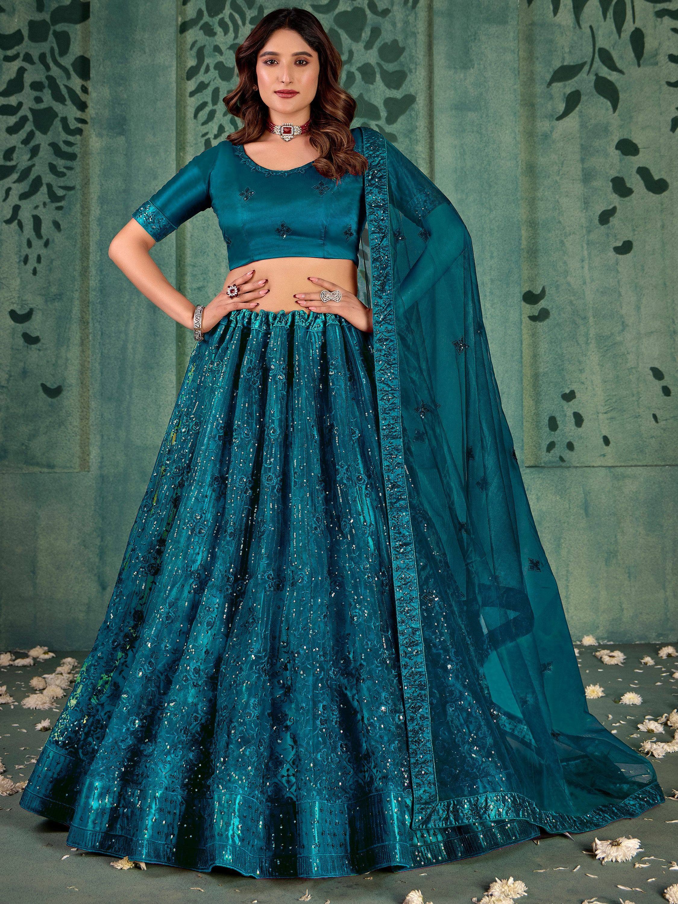 Teal blue designer lehenga choli with sequin embroidery and sheer dupatta, perfect for Indian ethnic wear events.