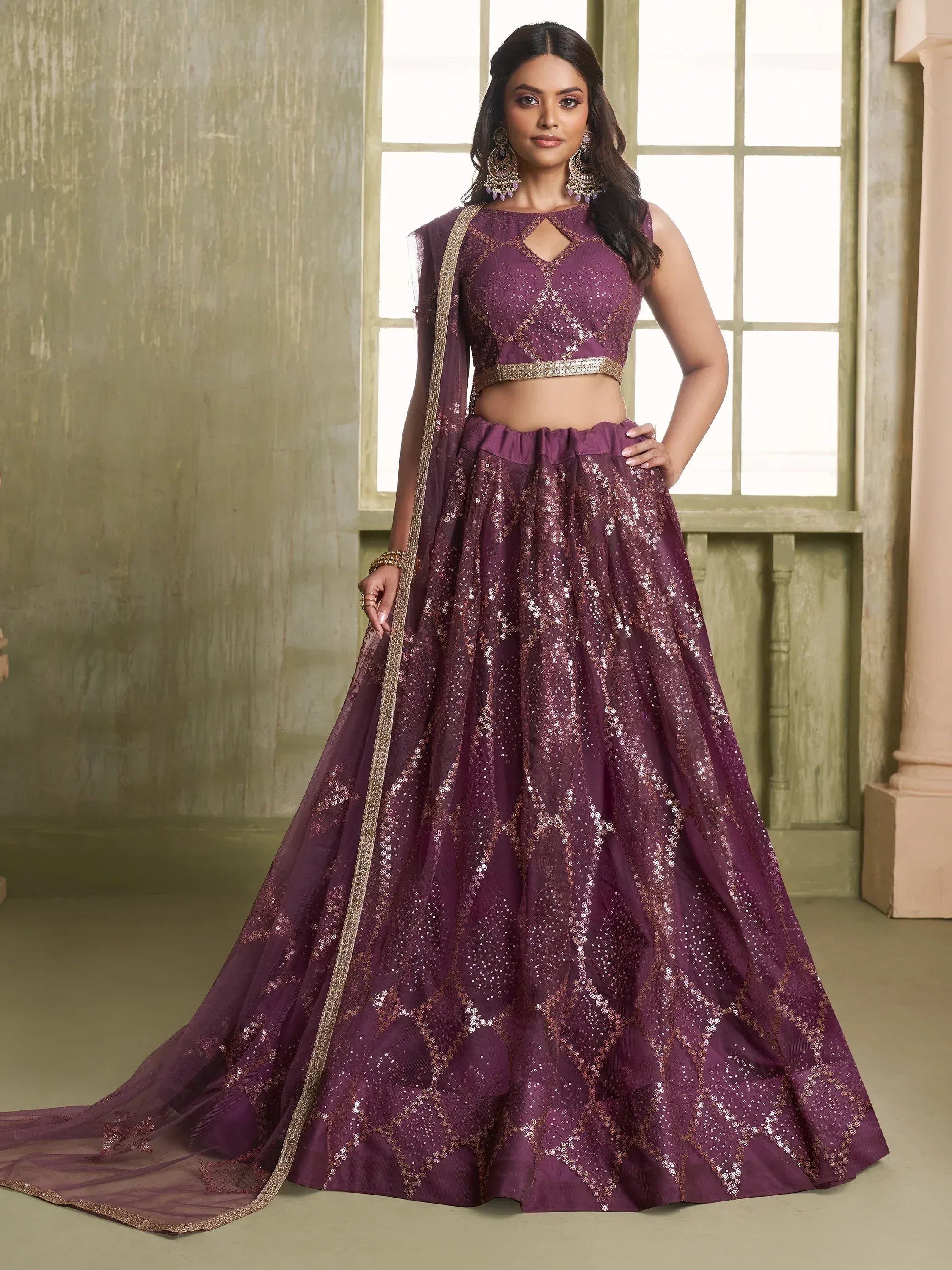 Purple sequin lehenga choli with gold embroidery, perfect for Indian ethnic wear and festive occasions.