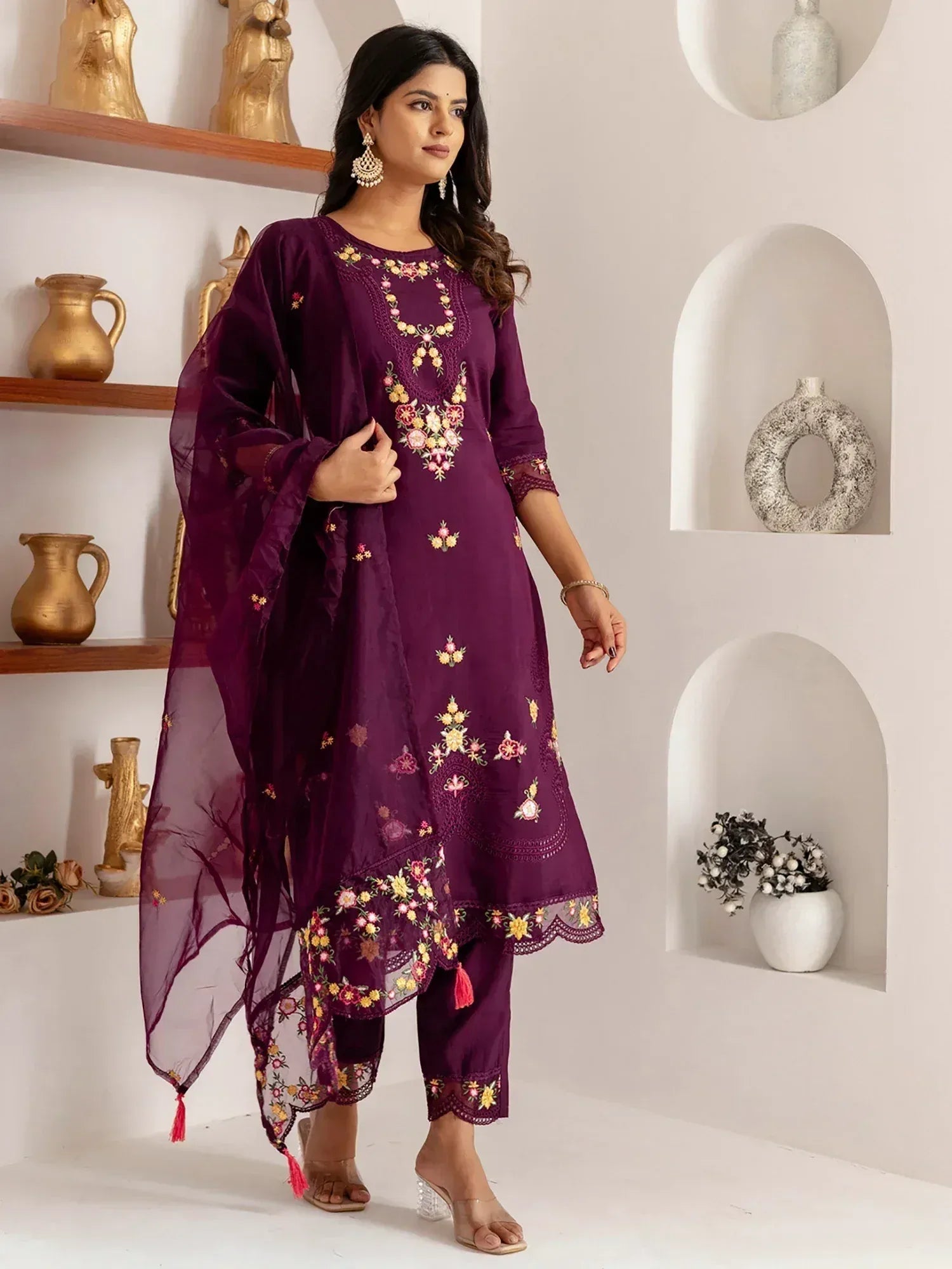 Purple embroidered salwar kameez with floral detailing and matching dupatta, ideal for ethnic occasions