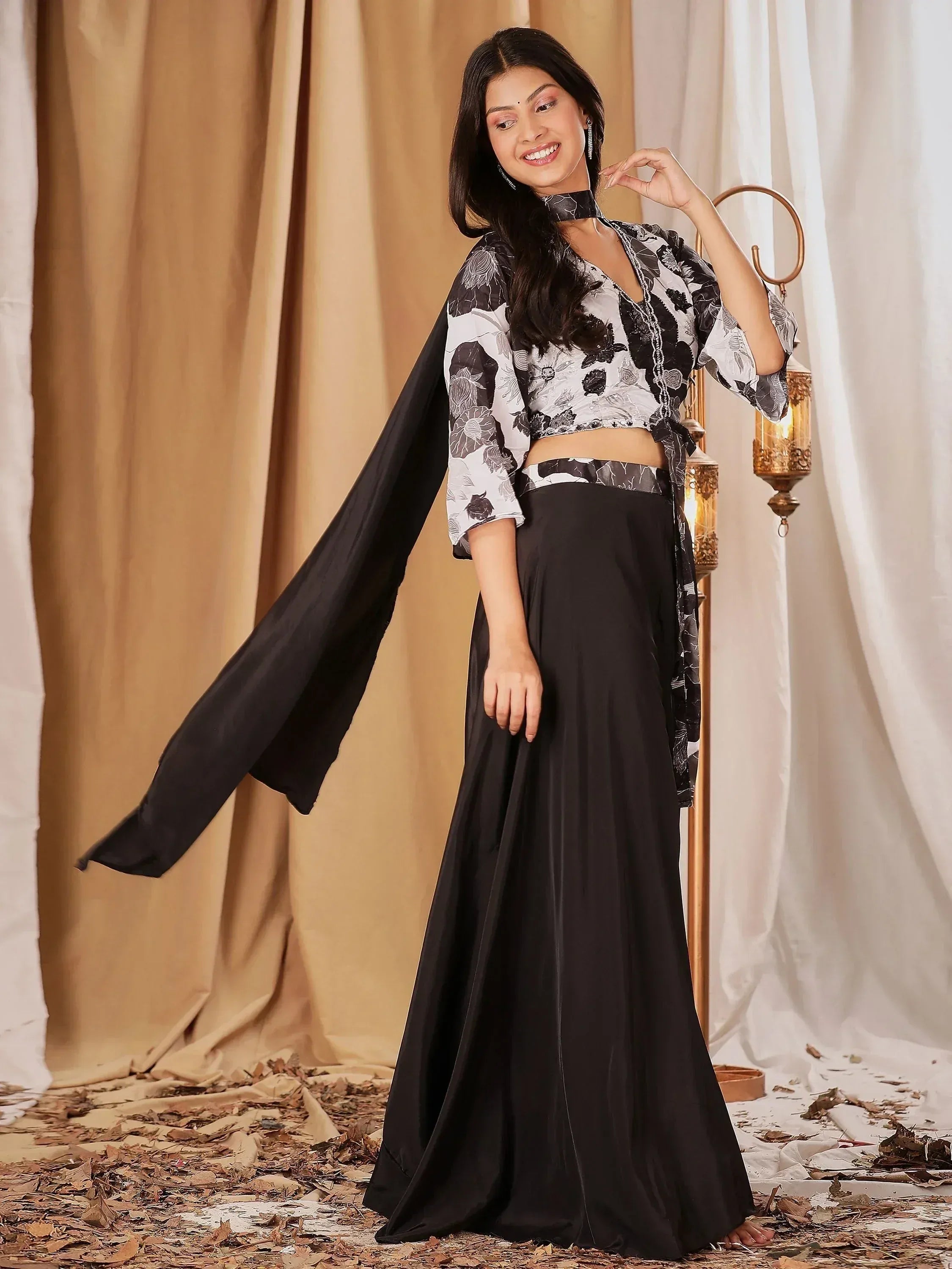 Stylish black and white floral ethnic gown with flowing skirt and cape