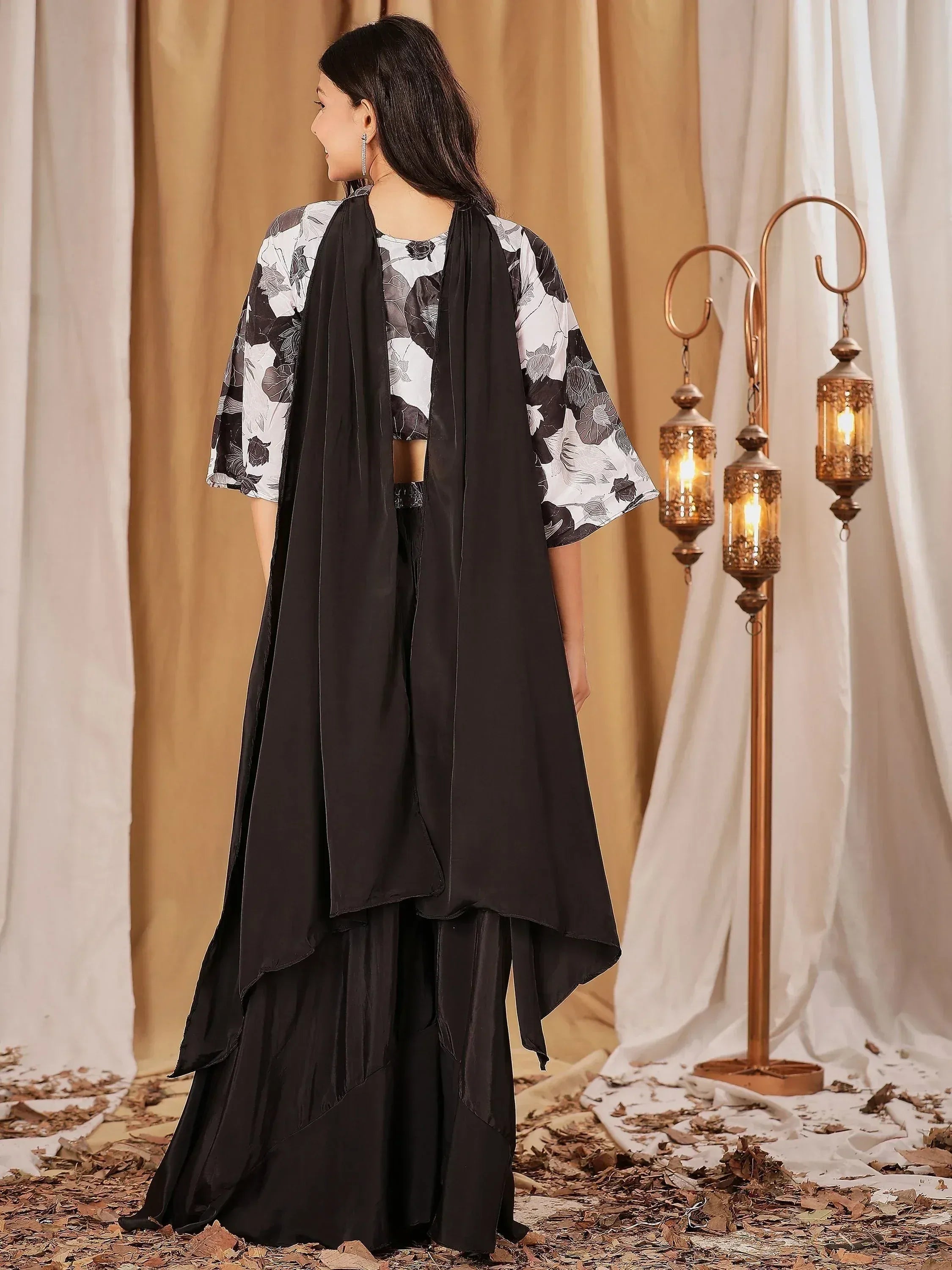 Black floral ethnic gown with layered skirt and draped dupatta, perfect for Indian occasions