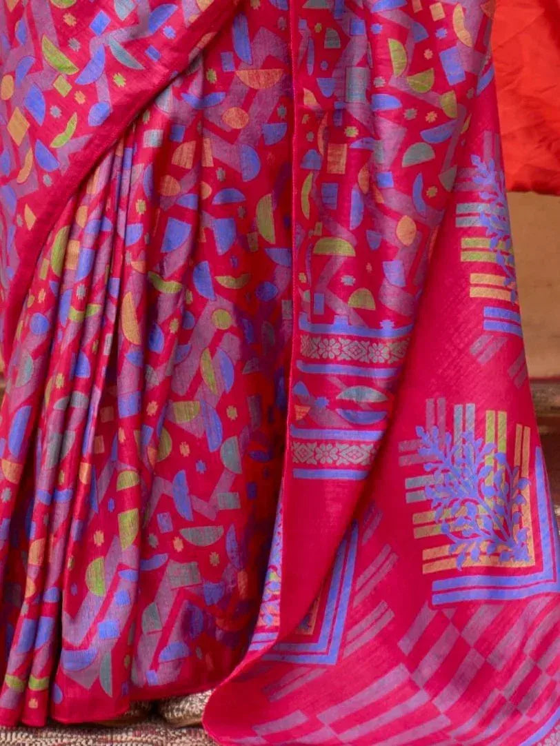 Vibrant pink saree with geometric blue and green print, perfect for Indian ethnic wear occasions