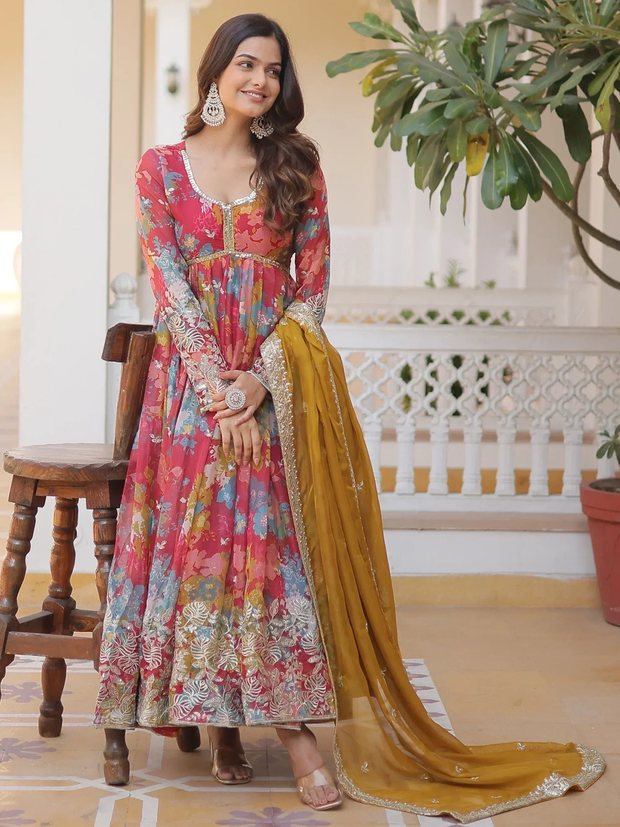 Woman in floral print ethnic anarkali with gold dupatta, perfect for Indian weddings and festivals