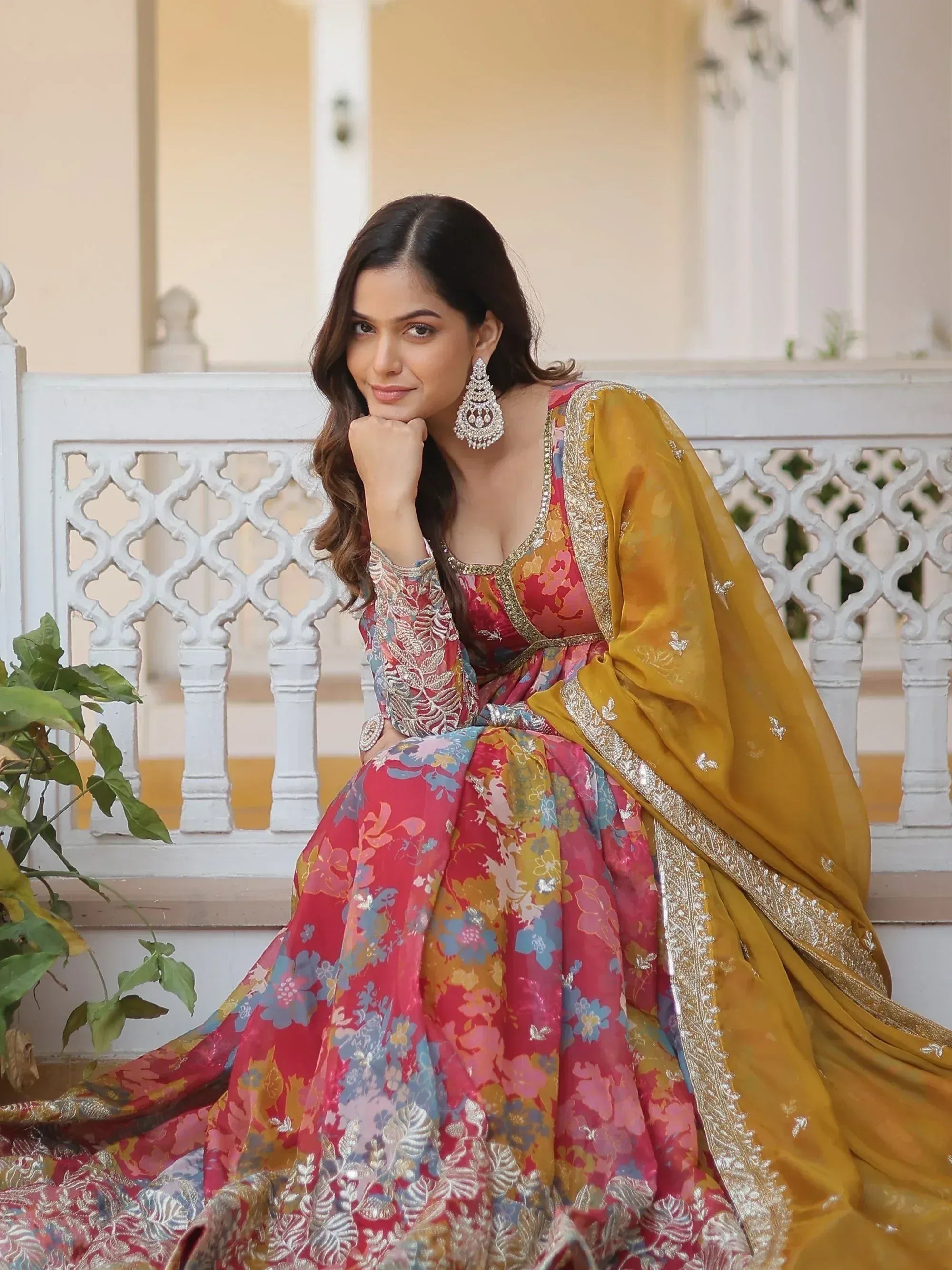 Woman in floral lehenga choli with gold dupatta, ethnic Indian wear for weddings and festivals