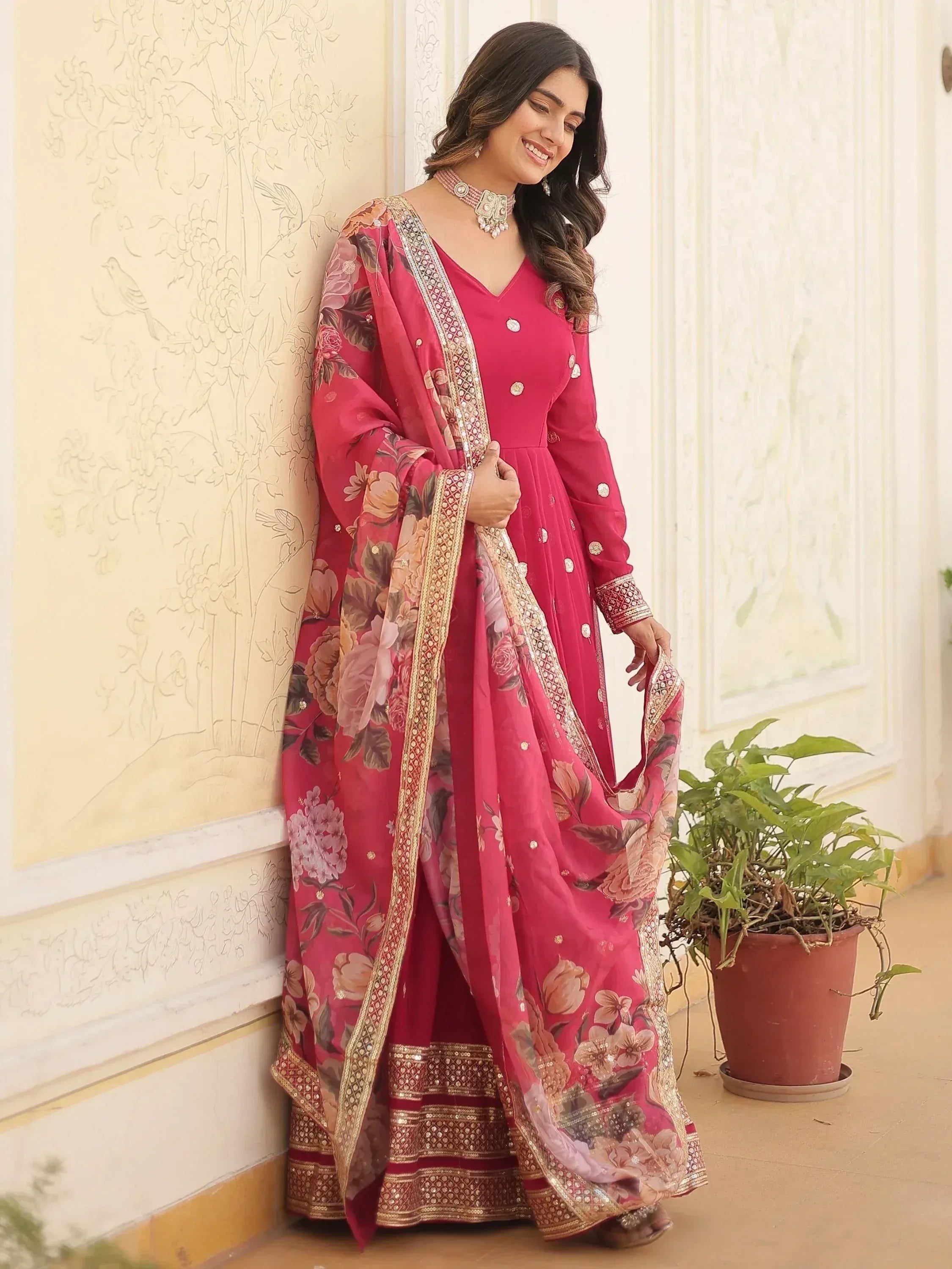 Pink floral printed Indian ethnic anarkali suit with gold embroidery and dupatta, perfect for weddings or parties