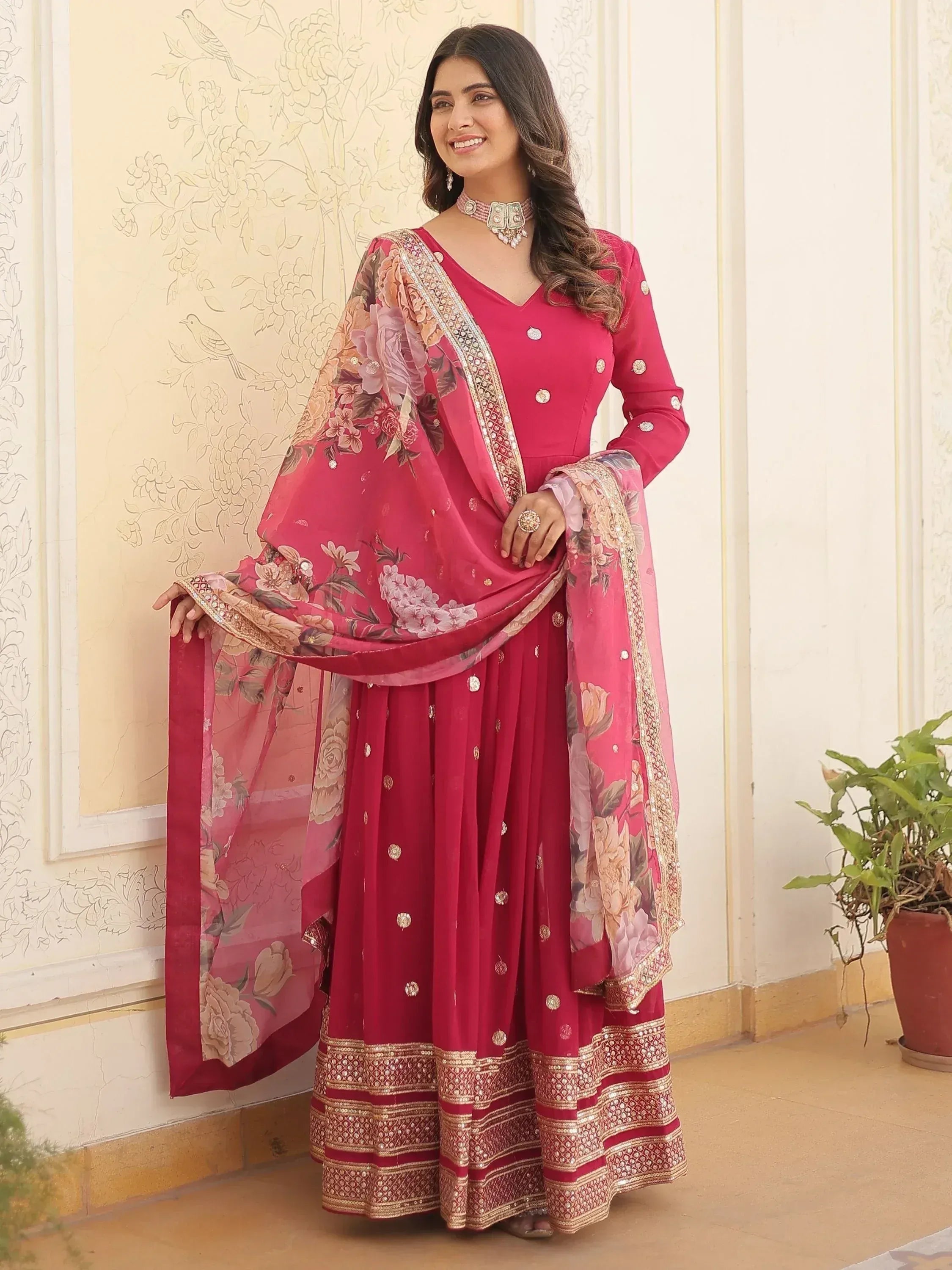 Pink floral printed Indian salwar kameez with embroidered dupatta and embellished hem