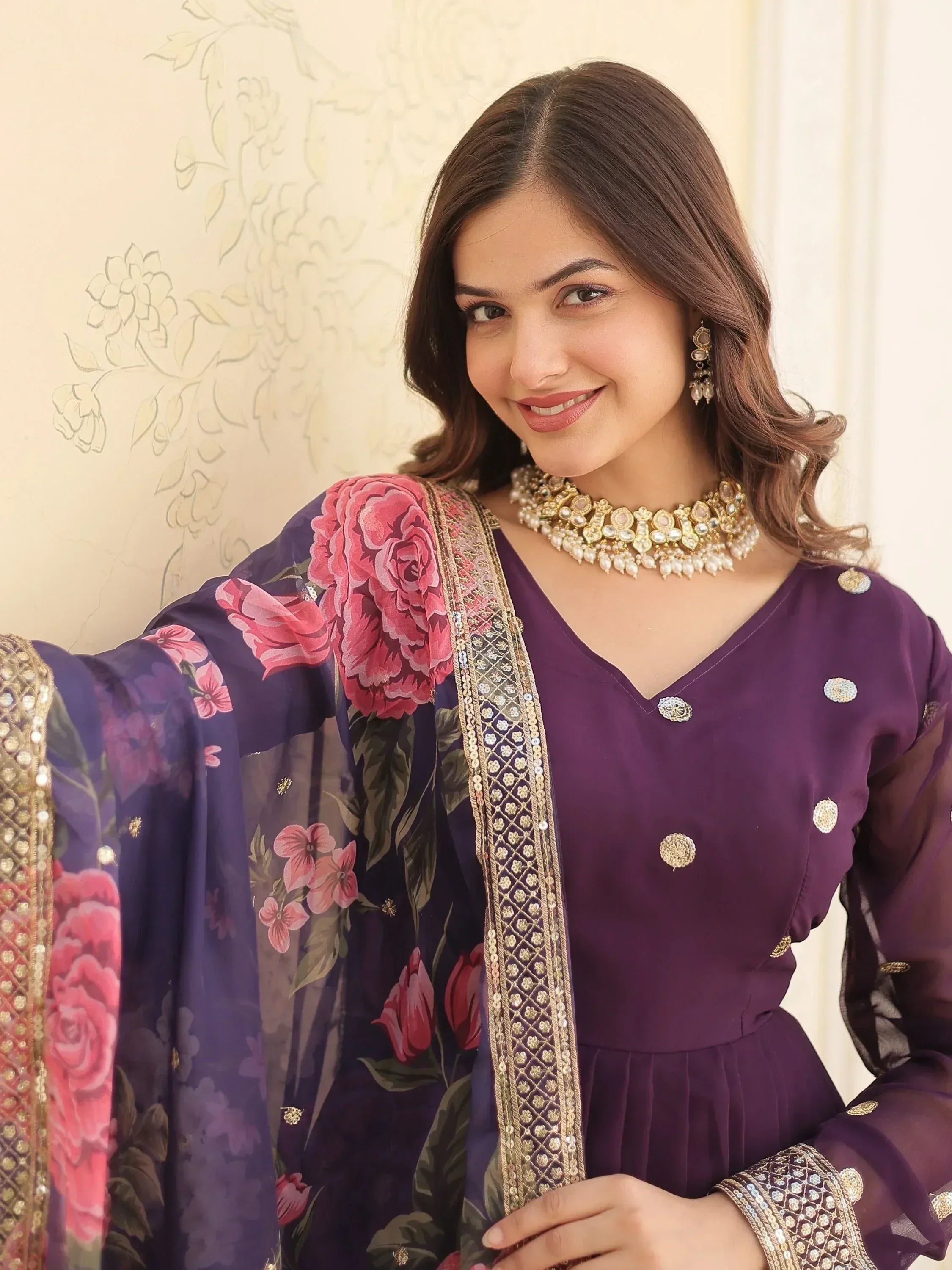 Purple floral printed Indian ethnic gown with gold embroidery and matching jewelry